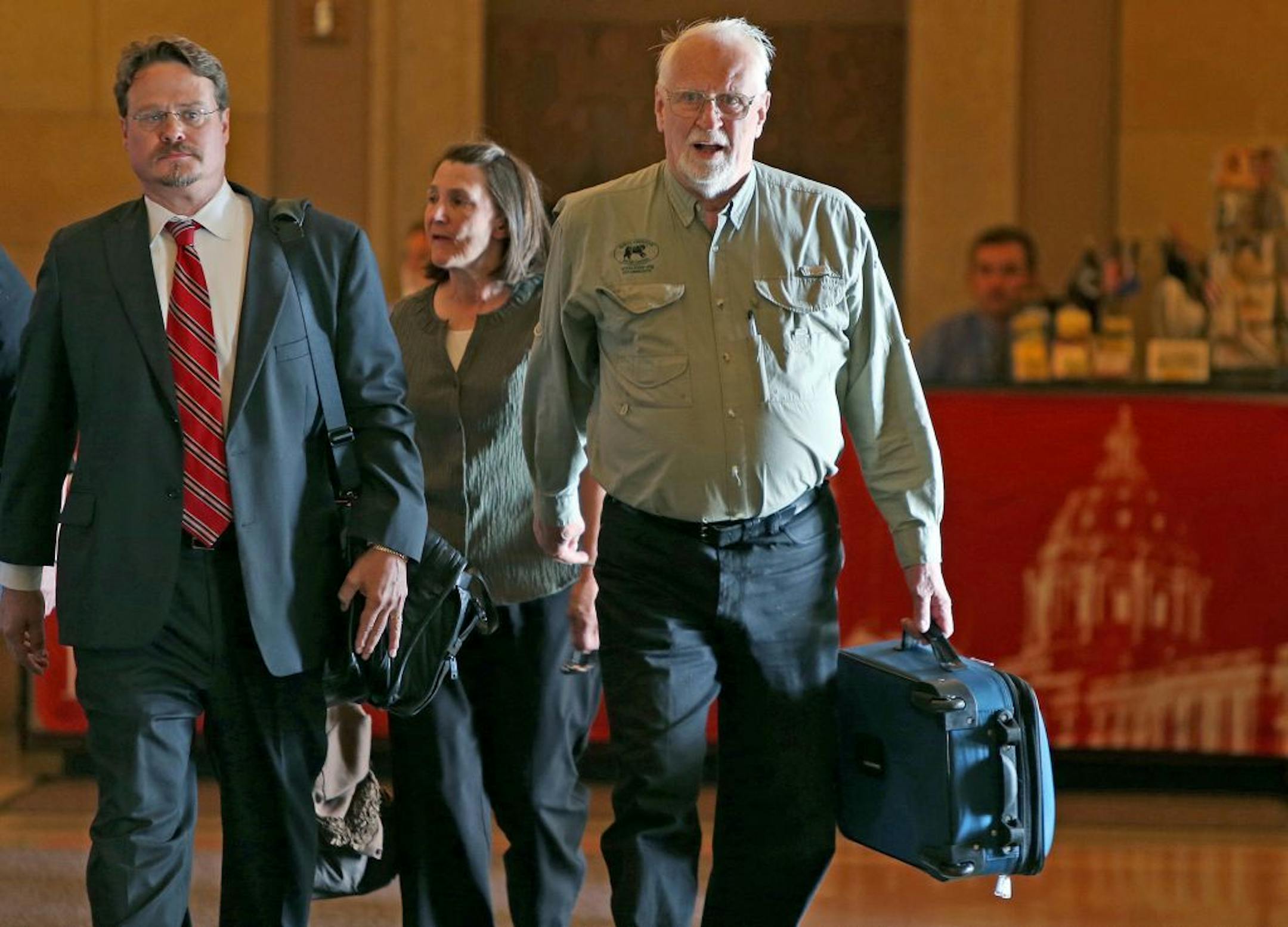 Lynn Rogers, right, made his way into the Governor's office on Monday.