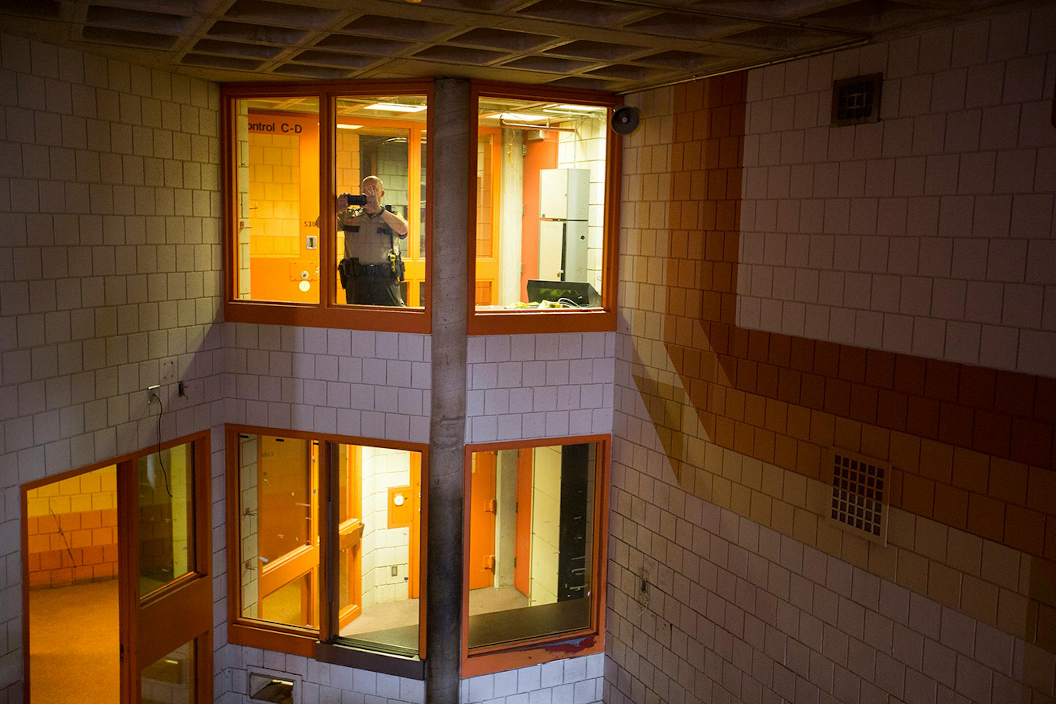 Ramsey County Water Patrol Deputy Sheriff Ken Urbina takes photos while leading a tour of the former Ramsey County jail in downtown St. Paul on Friday, May 29, 2015.