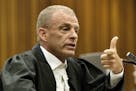 State prosecutor Gerrie Nel during cross questioning of Oscar Pistorius, in court in Pretoria, South Africa, Thursday, April 10, 2014.