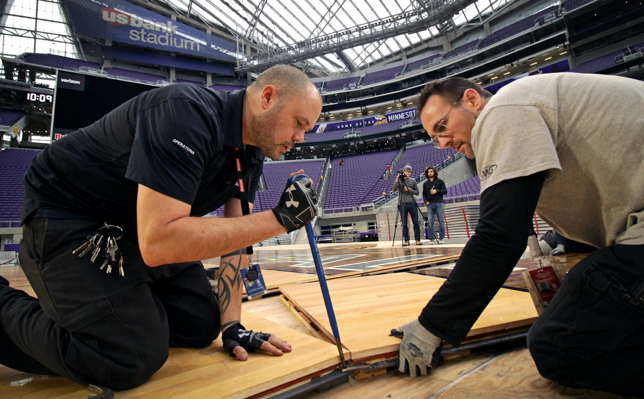 Preparations are underway for the U.S. Bank Stadium Basketball Classic, the venue's first basketball event. Here, Ricky Gieser and Michael Stauffacher help lay the basketball court floor Tuesday morning.] Minnesota Vikings -vs- Green Bay Packers - U.S. Bank Stadium
BRIAN PETERSON • brian.peterson@startribune.com
Minneapolis, MN 11/27/2018