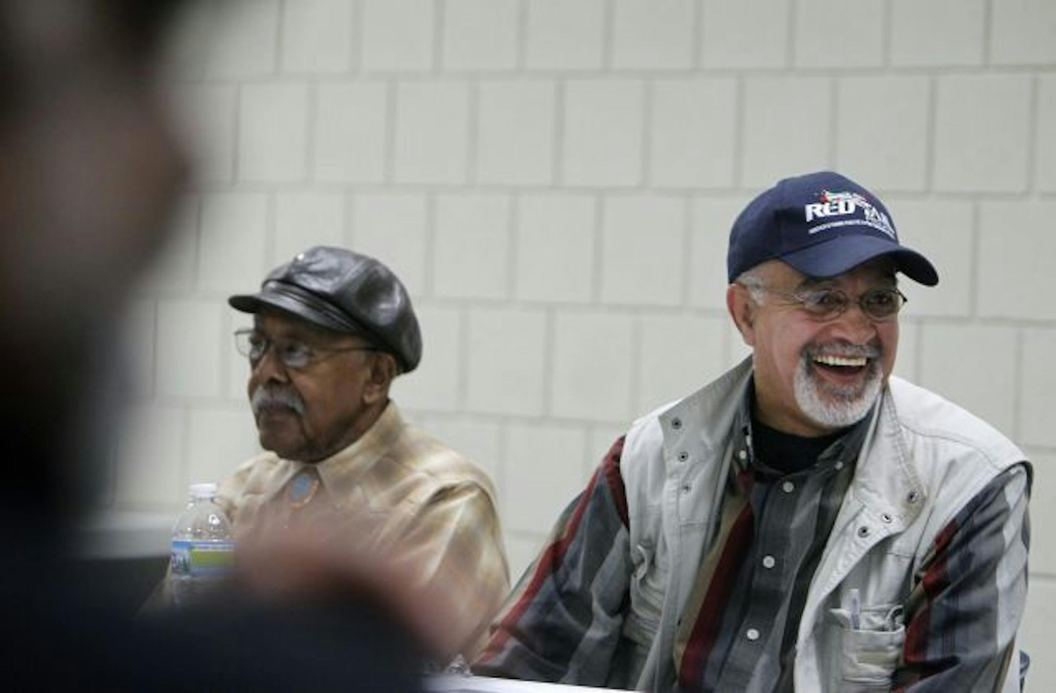 At the MLK center, 67 yr old Nick , right, sits next to his uncle George Davis, 84, left in the Hallie Q. Brown retired men's group which meets twice a month. Khaliq has lived in St. Paul's Selby-Dale area all his life. He's a neighborhood activist and human rights advocate who has taken on city leaders and law enforcement as a citizen and 15-year president of the local NAACP chapter.