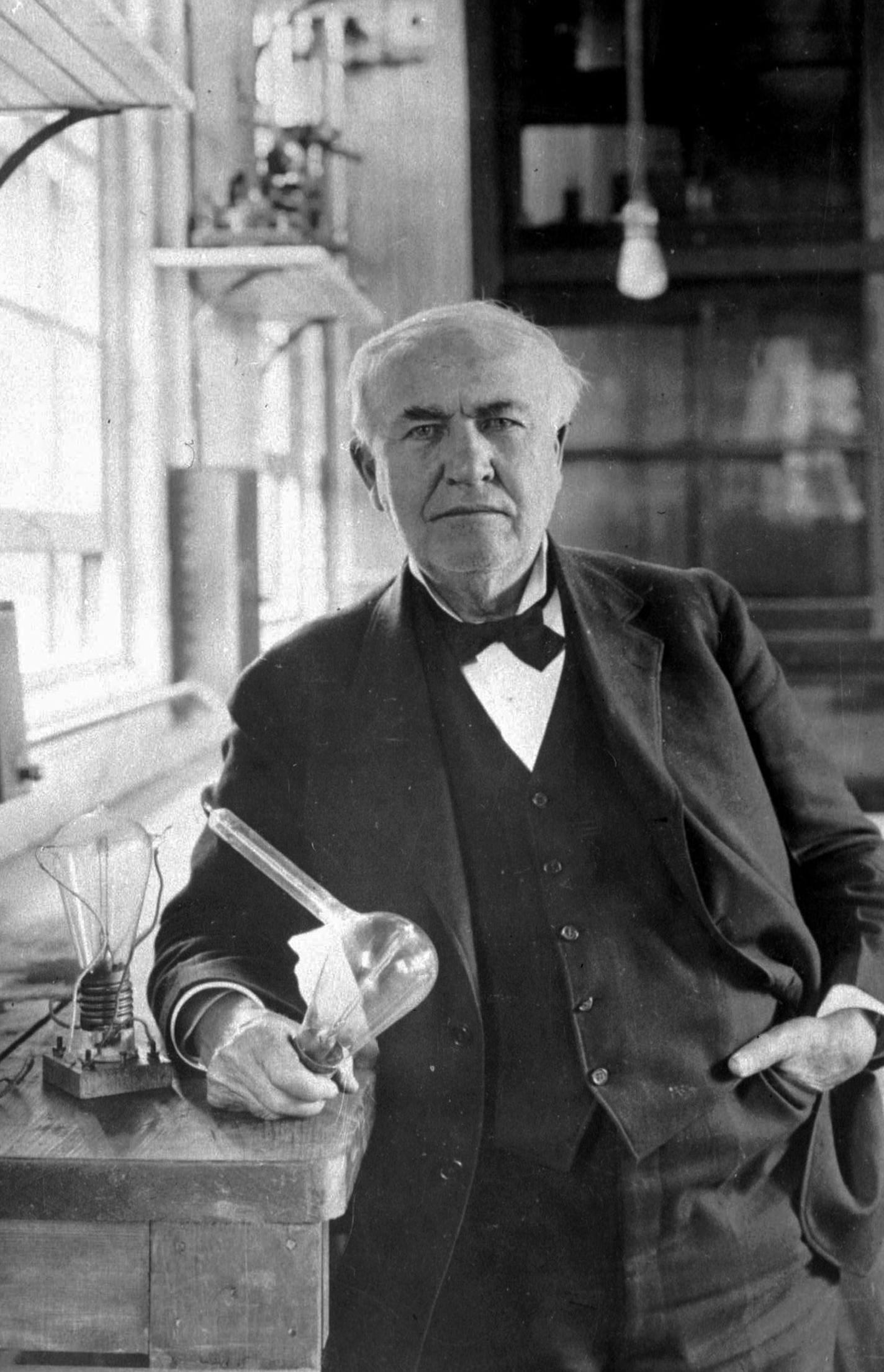 FILE - In this undated photo one of history's greatest inventors, Thomas Alva Edison, holds his "Edison Effect" light bulb in his West Orange, N.J., laboratory, the first long-lasting, practical electric light bulb. Edison, who held more than 2,000 patents worldwide, applied principles of mass production and large teamwork to the invention process and is often credited with the creation of the first industrial research laboratory. (AP Photo/J. Walter Thompson, File)