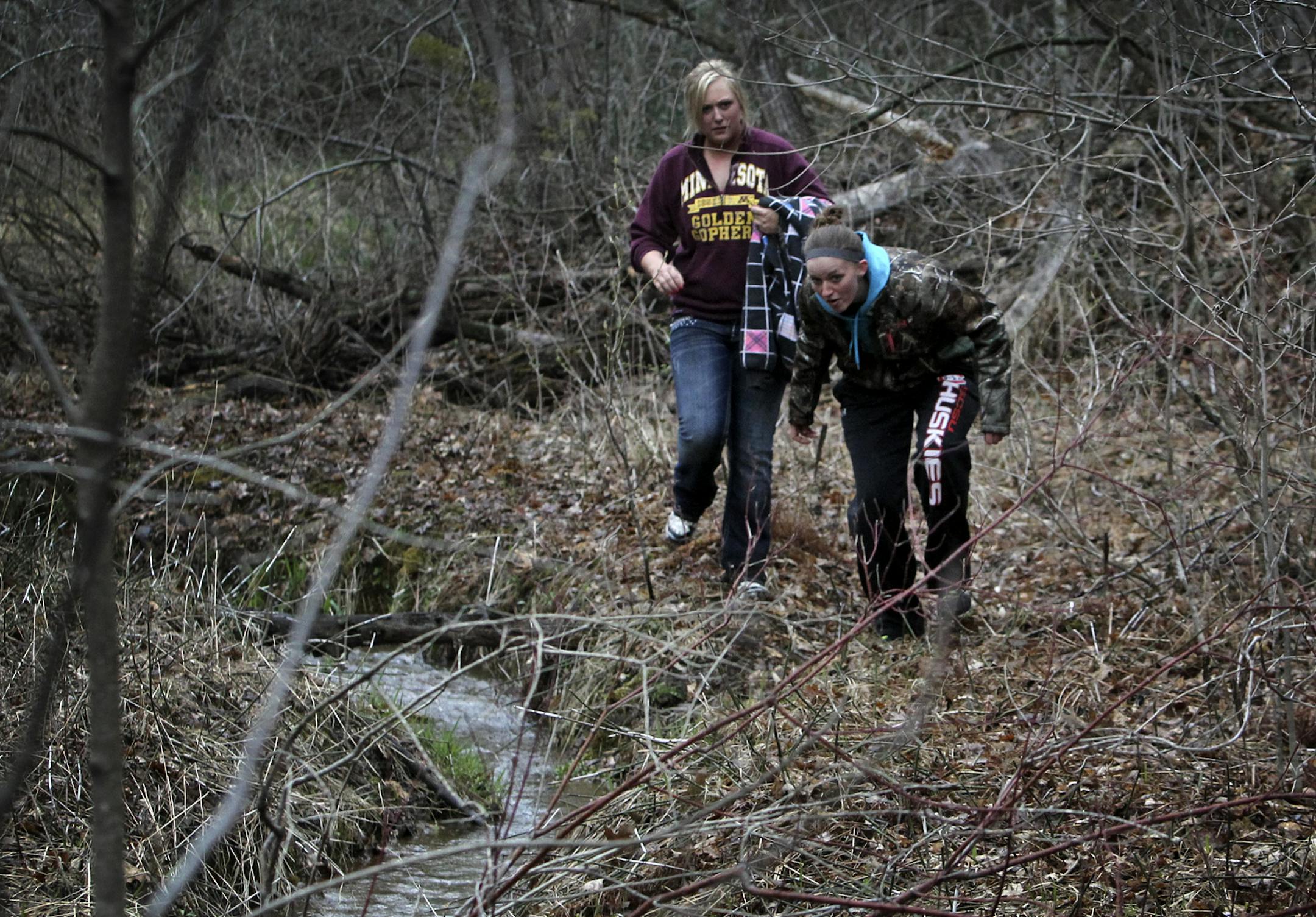 Family and friends of missing Eden Prairie woman Mandy Marie Matula gathered Friday night at the city park where she was last seen early Thursday, splitting up into groups to search it and other nearby parks. Here, St. Cloud State students Paige Olson, left, and Alyssa Graham, who took off school to help with the search, comb the area along a creed in Richard T. Anderson Conservation Area for signs of Matula Friday, May 3, 2013, at in Eden Prairie, MN. ](DAVID JOLES/STARTRIBUNE) djoles@startribu