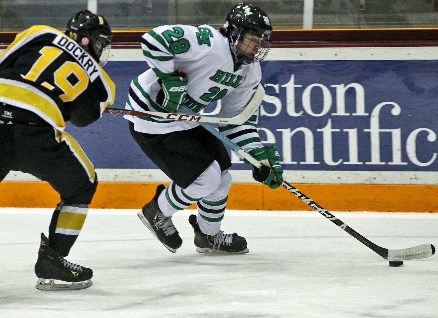 Schwan Cup boys high school hockey semifinal game. Hill Murray vs. Burnsville. Hill Murray's Mitch Slattery (28) brought the puck down the ice against the defense of Burnsville's Sam Dockry (19). (MARLIN LEVISON/STARTRIBUNE(mlevison@startribune.com (cq - all names program)