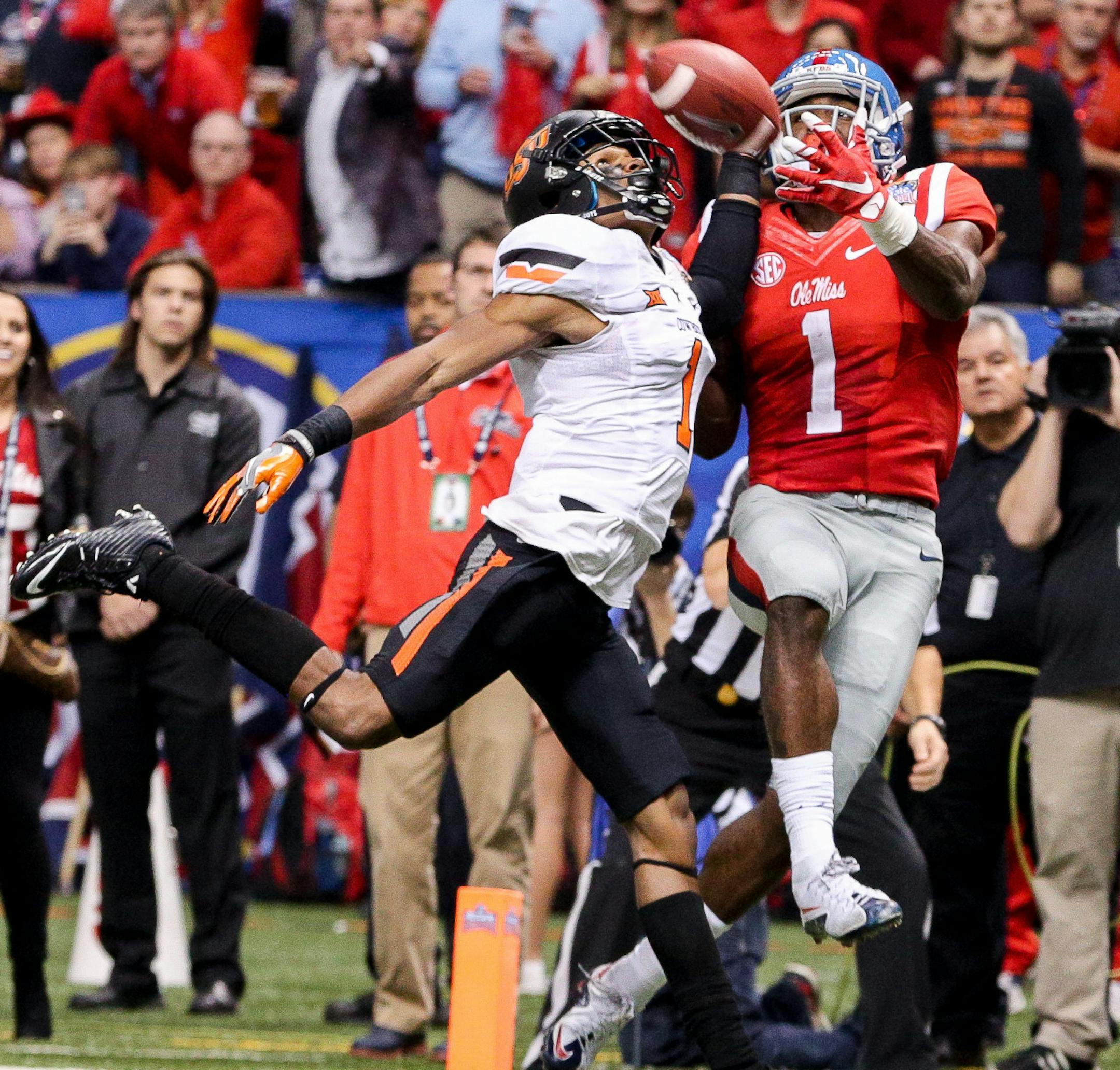 January 01, 2016: Ole Miss Rebels wide receiver Laquon Treadwell (1) catches a touchdown against Oklahoma State Cowboys cornerback Kevin Peterson (1) during the game between the Ole Miss Rebels and the Oklahoma State Cowboys at Mercedes-Benz Superdome in New Orleans, LA. (Photograph by Stephen Lew/Icon Sportswire) (Icon Sportswire via AP Images) ORG XMIT: 250886