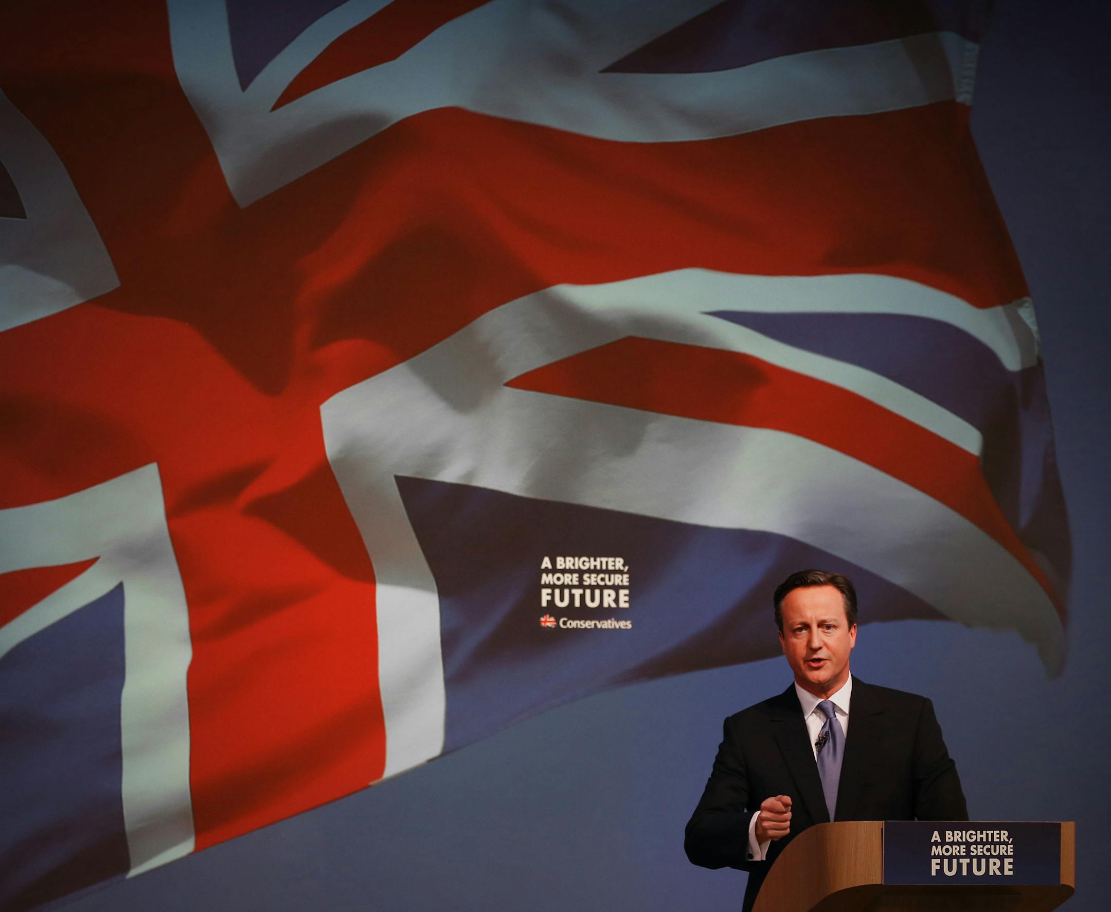 Britain's Prime Minister David Cameron gestures as he unveils the Conservative party manifesto, in Swindon, England, Tuesday April 14, 2015. Britain goes to the polls for a parliamentary election on Thursday May 7, 2015. (Peter Macdiarmid, Pool Photo via AP)