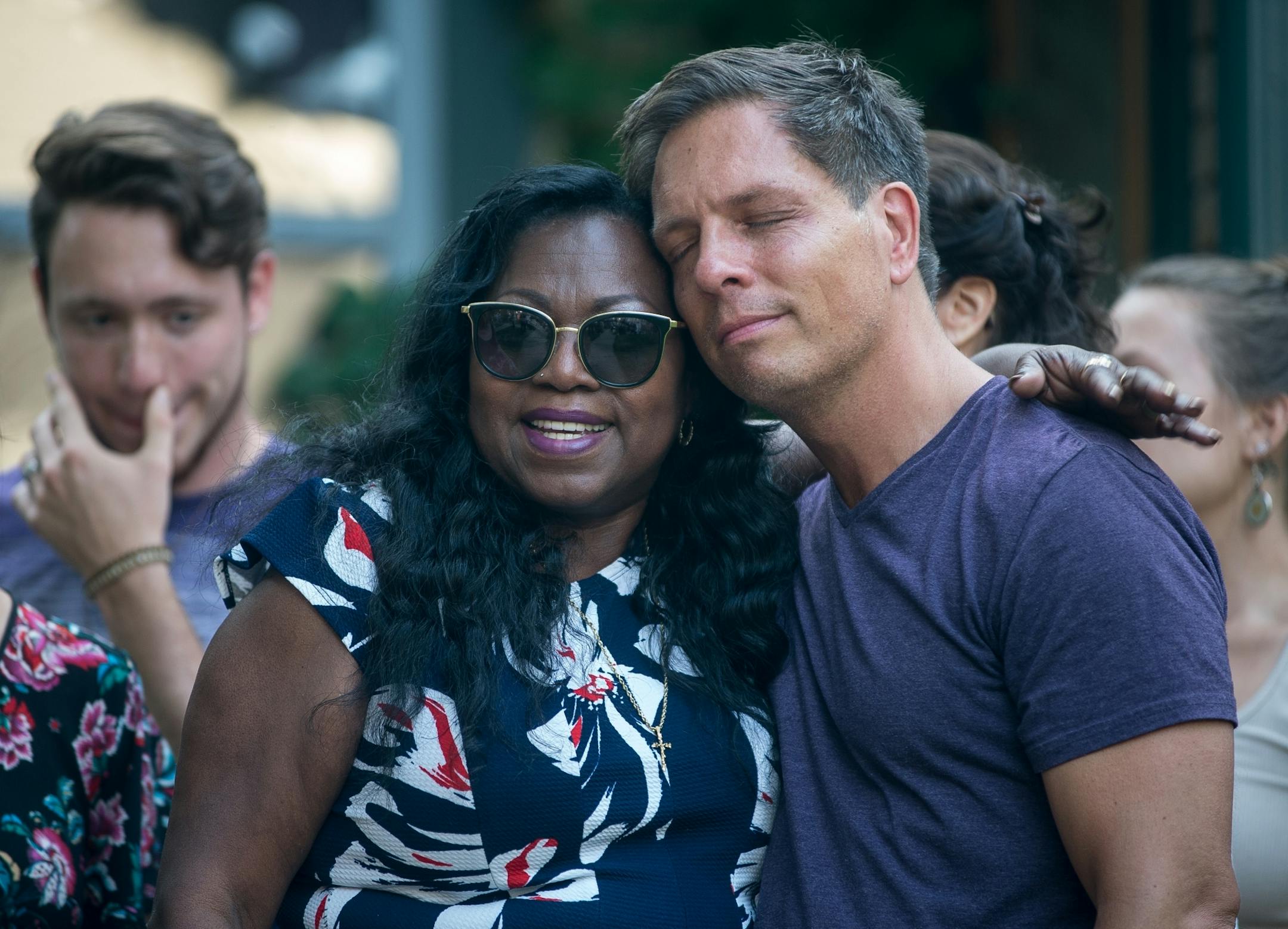 Don Damond, the fianc� of Justine Damond, was comforted outside his home by Valerie Castile, the mother of Philand Castile, as demonstrators marched by Damond's home during the Peace and Justice March for Justine Thursday.