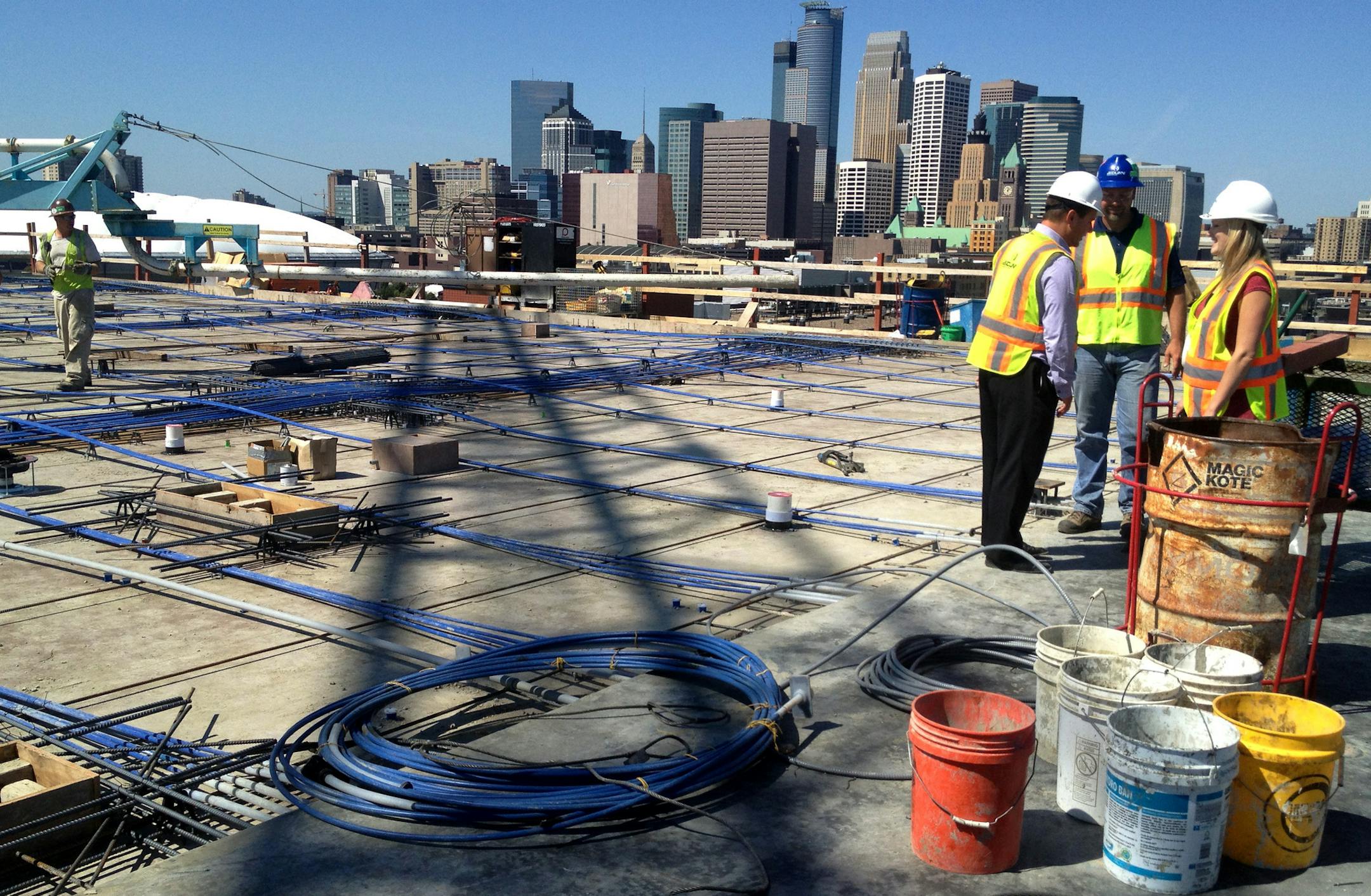 This week, crews poured the concrete for the top floor of Stonebridge Lofts, the only condo building under construction in downtown Minneapolis. Demand has been strong: Just nine months after construction began, more than half of the 264 units have sold, according to sales broker Colleen Ratzlaff LaBeau. During the topping-off cere­mony, two officers of the St. Paul Area Association of Realtors, communications director Kim Broback, right, and government affairs director and Eric Myers, left, got