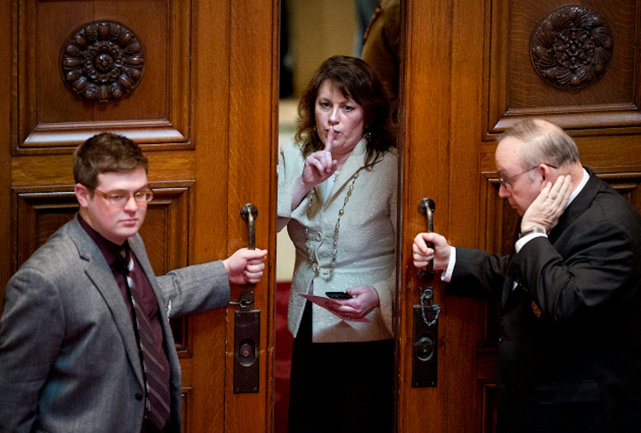 Senator Michelle Benson motioned to colleagues that she would be right back as she left theSenate chamber during debate of the health insurance exchange.   Thursday, March 7, 2013.      ]   GLEN STUBBE * gstubbe@startribune.com