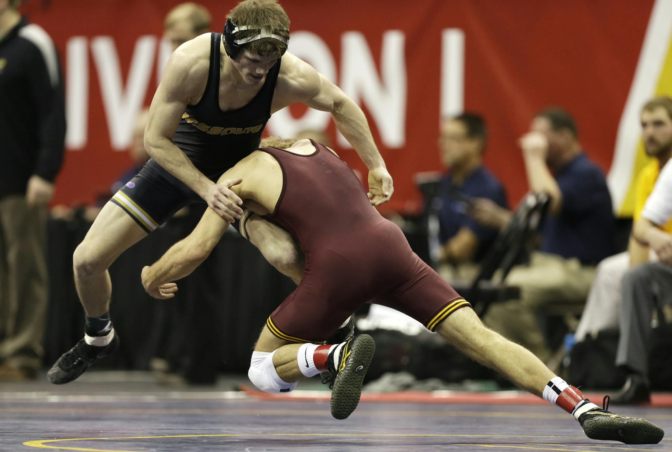 Dylan Ness of the Gophers grabbed the leg of Missouri’s Drake Houdashelt in their 149-pound match. Ness lost 5-2 in the second round at the NCAA meet.