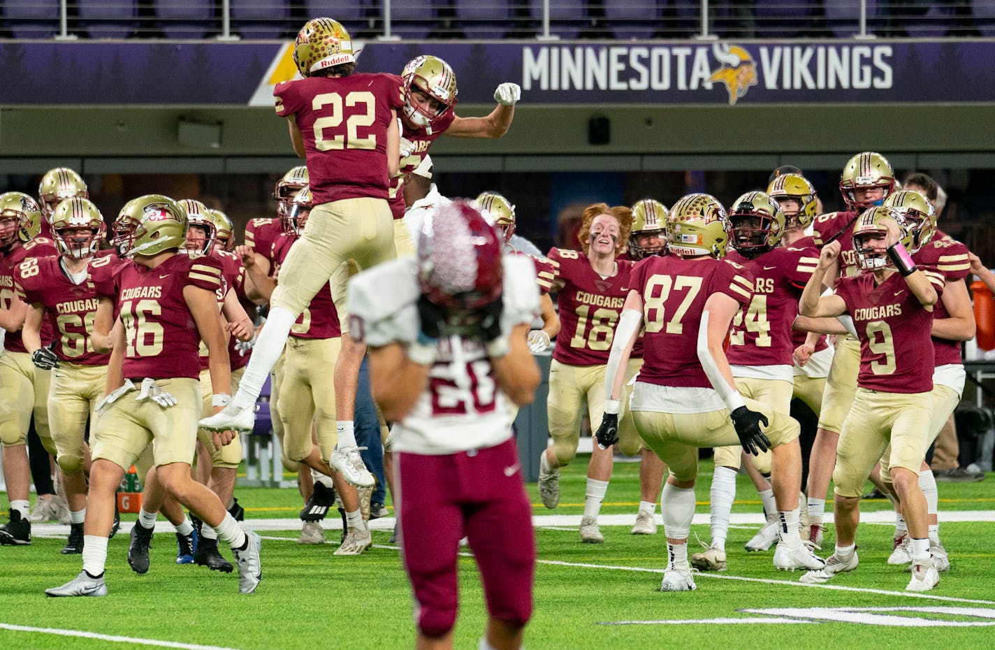 Lakeville South High School players celebrate after stopping Maple Grove High School on a final fourth down play to seal their 13-7 victory in the Minnesota High School football Class 6A State Championship Friday, Nov. 26, 2021 at U.S. Bank Stadium in Minneapolis. ]