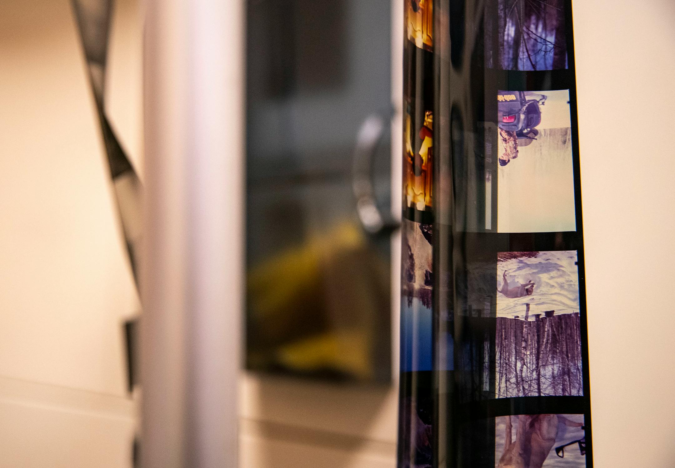 Film orders that had been finished hung on a rack in First Photo on Wednesday, March 31, 2021.
