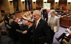 Gov. Mark Dayton left following the end-of-year budget forecast Tuesday.