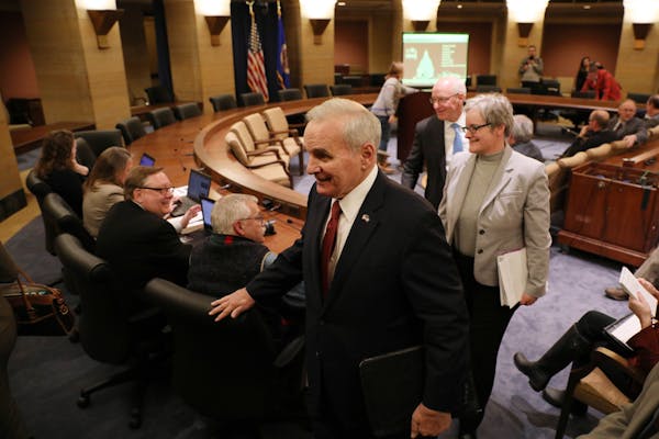 Gov. Mark Dayton left following the end-of-year budget forecast Tuesday.