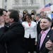 Rhode Island House Speaker Gordon Fox, left, is kissed by R.I. Rep. Frank Ferri, D-Warwick, after a gay marriage bill was signed into law outside the 