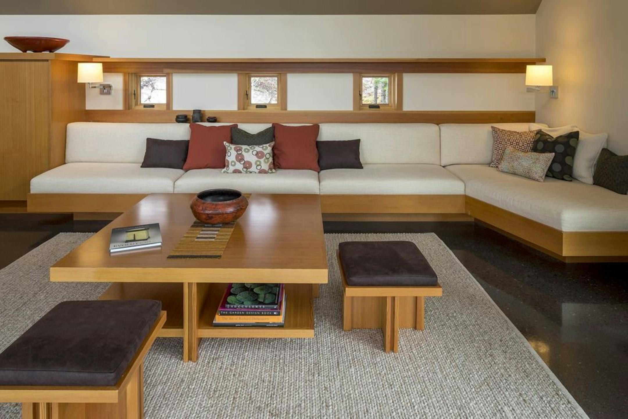 Porthole windows above the built-in Douglas fir sofa.