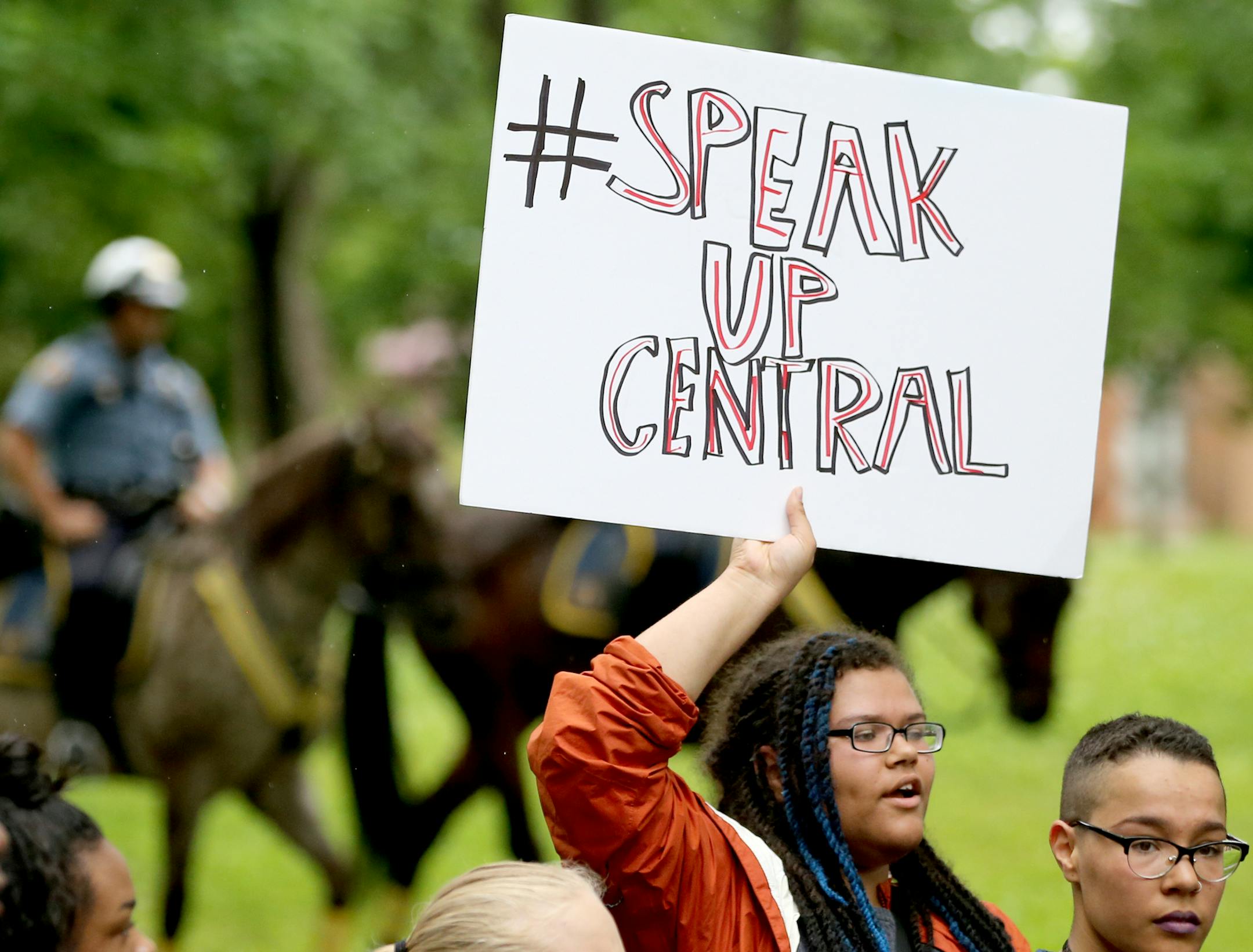 St. Paul Central High School students and some supporters march down Marshall Ave. towards City Hall, accompanied by St. Paul police officers on horses, Tuesday, May 31, 2016, in St. Paul, MN. The students walked out of class to protest what they believed to be a manhandling last week of a black youth by a cop assigned to the high school.](DAVID JOLES/STARTRIBUNE)djoles@startribune Students at St. Paul Central High School are walking out to protest what they perceived to be the manhandling last