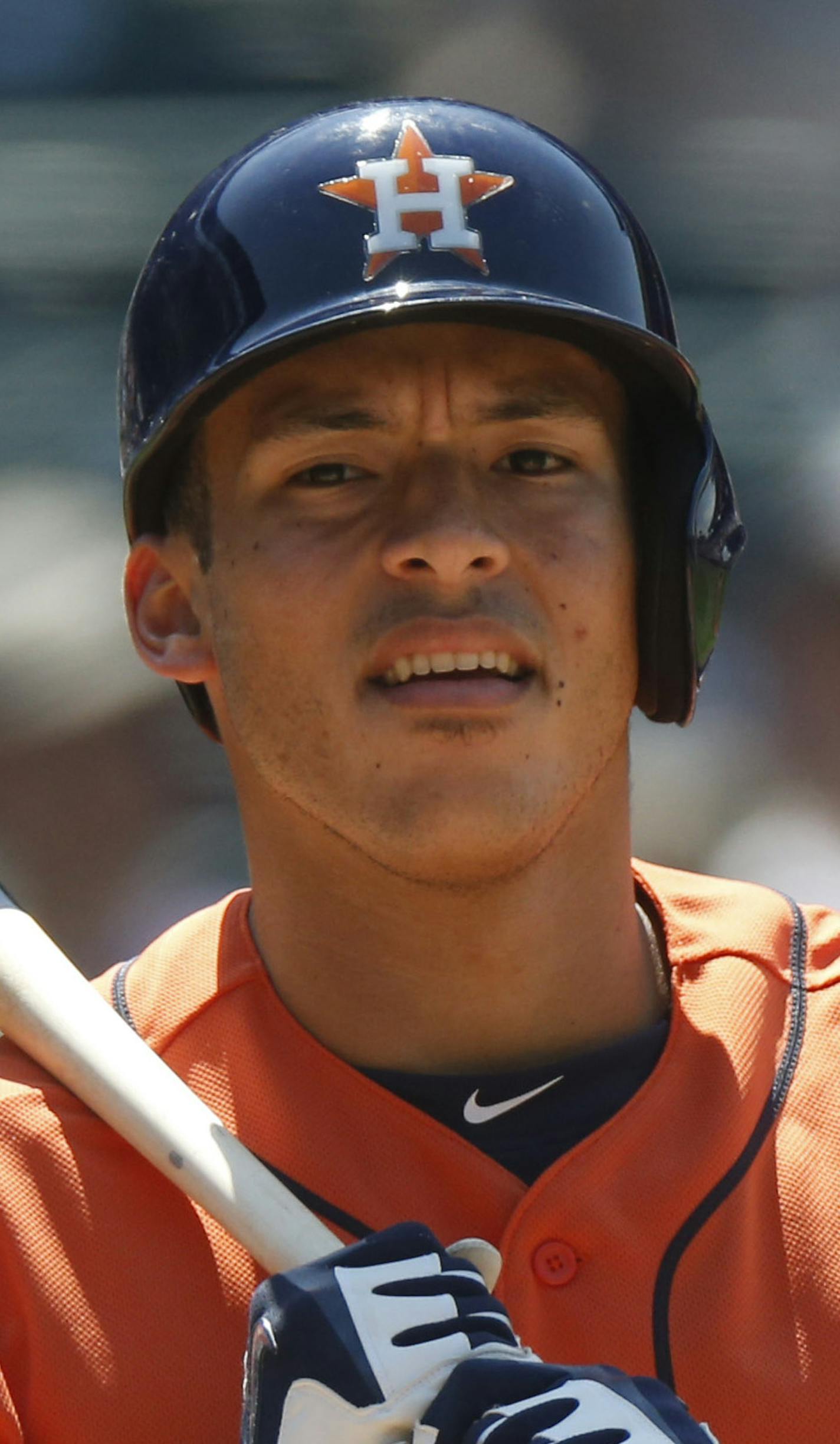 Houston Astros shortstop Carlos Correa waits to bat against he Colorado Rockies in the fifth inning of an interleague baseball game Thursday, June 18, 2015, in Denver. (AP Photo/David Zalubowski) ORG XMIT: MIN2015061919124386