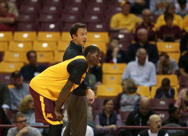 Gophers head coach Richard Pitino spoke with Carlos Morris during the intrasquad scrimmage Sunday afternoon. ] JEFF WHEELER • jeff.wheeler@startribu