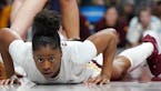 Gophers guard Jasmine Powell (4) collected herself up off the court after getting tripped up under the basket in the second half. ] ANTHONY SOUFFLE &#