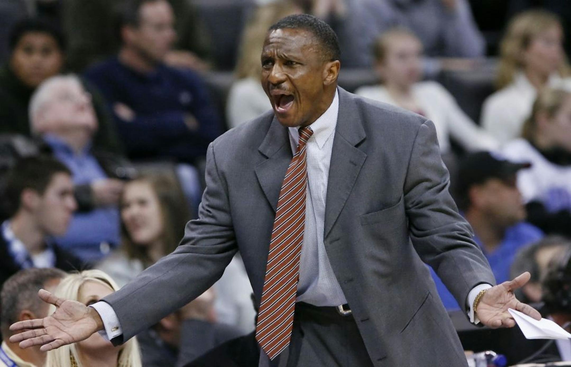 Dallas Mavericks assistant coach Dwane Casey yells to his team during an NBA basketball game against the Oklahoma City Thunder in Oklahoma City, Monday, Dec. 27, 2010. Dallas won 103-93. Mavericks coach Rick Carlisle missed the game after minor knee surgery.