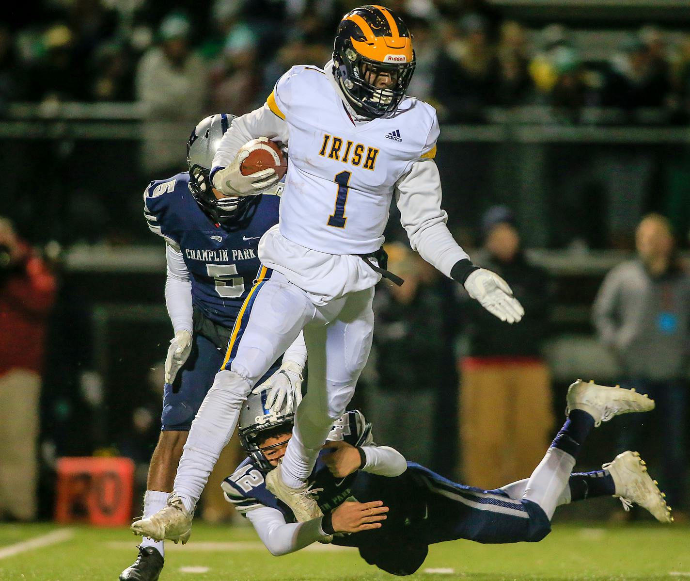 Rosemount kick returner Jonathan Mann (1) broke free of the attempted tackle of Champlin Park's Hayden Sanders (42) in the fourth quarter. Champlin Park beat Rosemount 34-7 in a Class 6A quarterfinal at Park Center High School. Photo by Mark Hvidsten, SportsEngine