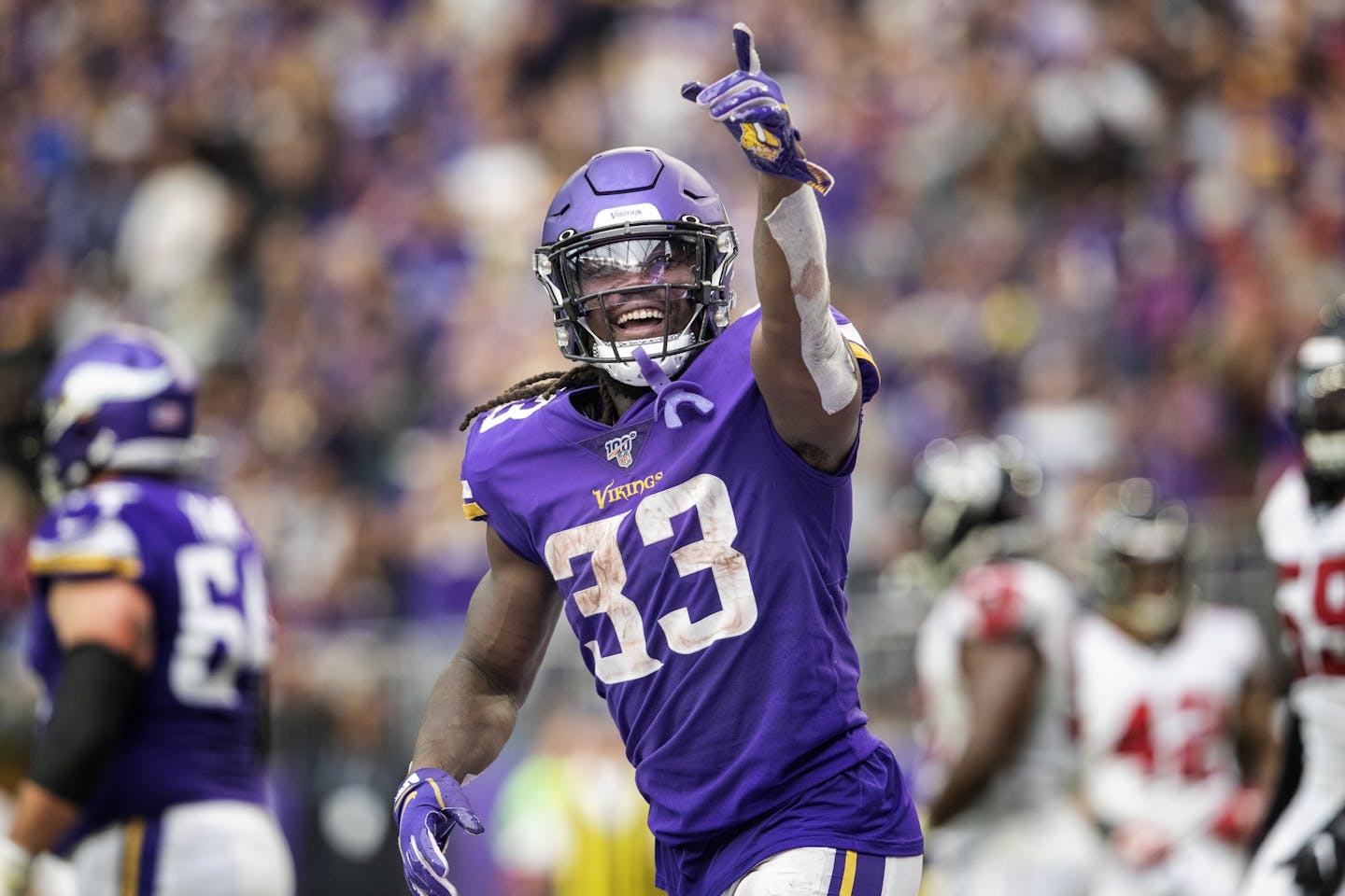 Minnesota Vikings running back Dalvin Cook (33) celebrated after scoring a touchdown in the third quarter.