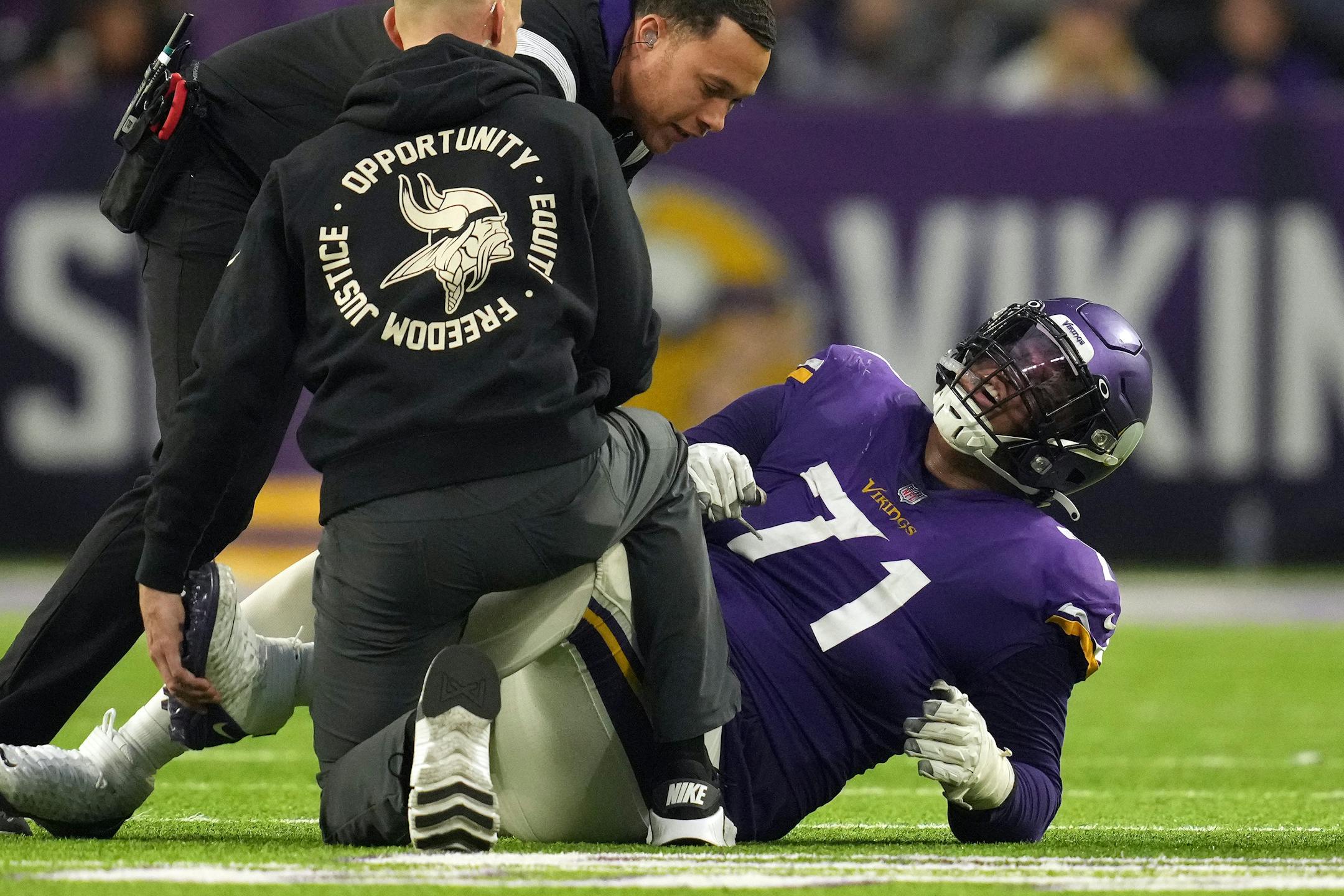 Minnesota Vikings offensive tackle Christian Darrisaw (71) goes down with an injury in overtime of an NFL game between the Minnesota Vikings and the Indianapolis Colts Saturday, Dec. 17, 2022 at U.S. Bank Stadium in Minneapolis. ] ANTHONY SOUFFLE • anthony.souffle@startribune.com