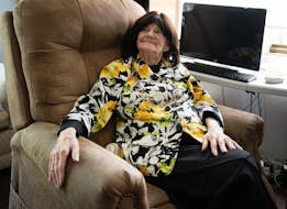 Debbie Weinberg, 87, normally would be watching her beloved Minnesota Twins on television, but instead finds other ways to pass the time at her home i