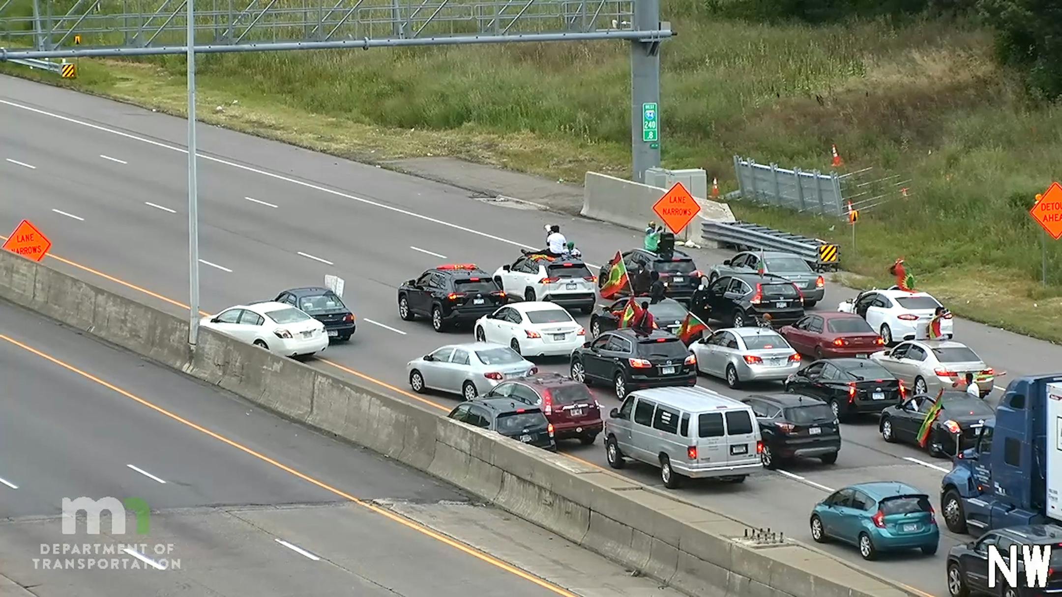 A convoy of vehicles driving at a snail's pace blocked all westbound lanes on I-94 between St. Paul and Minneapolis during Wednesday evening's commute.