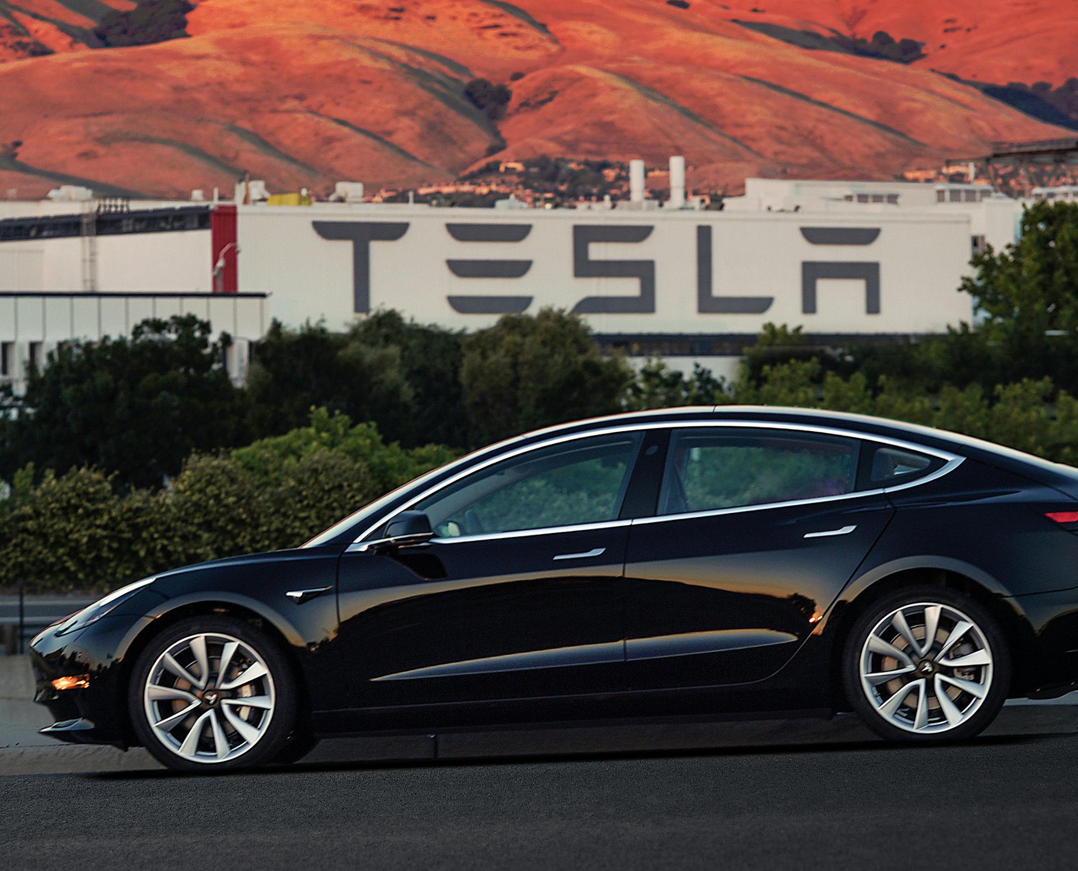 FILE - This file image provided by Tesla Motors shows the Tesla Model 3 sedan. Tesla Motors Inc. reports earnings on Wednesday, Aug. 2, 2017. (Courtesy of Tesla Motors via AP, File)