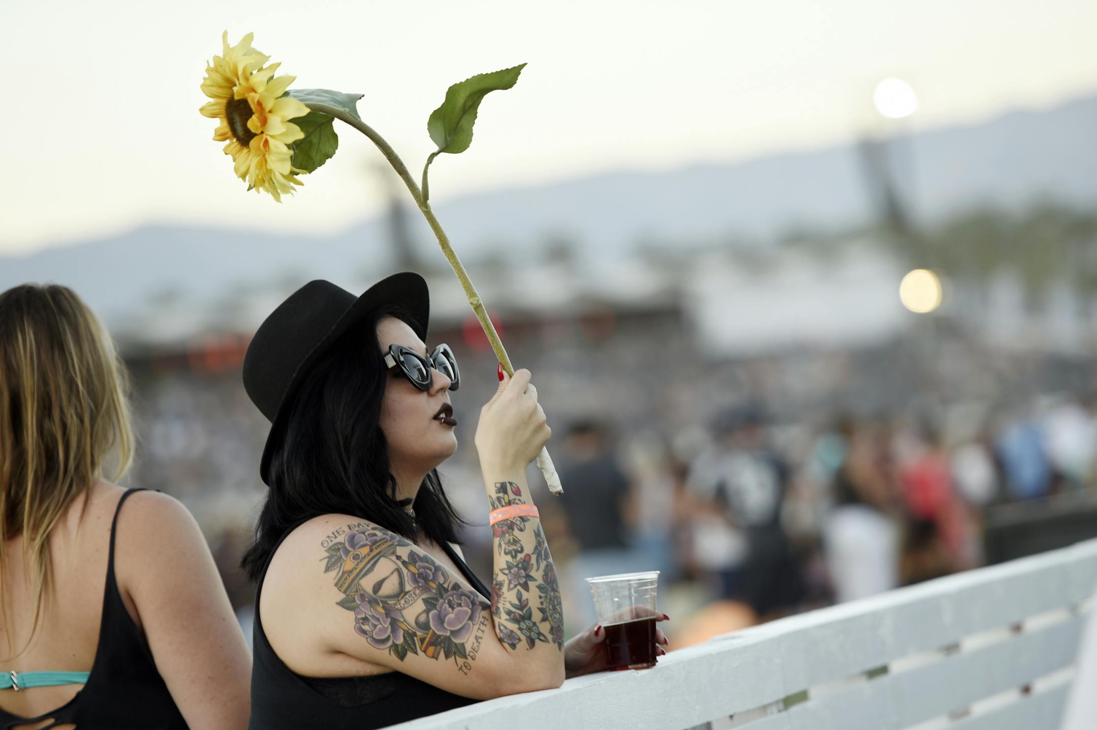 Nicole Demarbiex of Palm Desert, Calif. waits for Neil Young's performance to start on day 2 of the 2016 Desert Trip music festival at Empire Polo Field on Saturday, Oct. 8, 2016, in Indio, Calif.