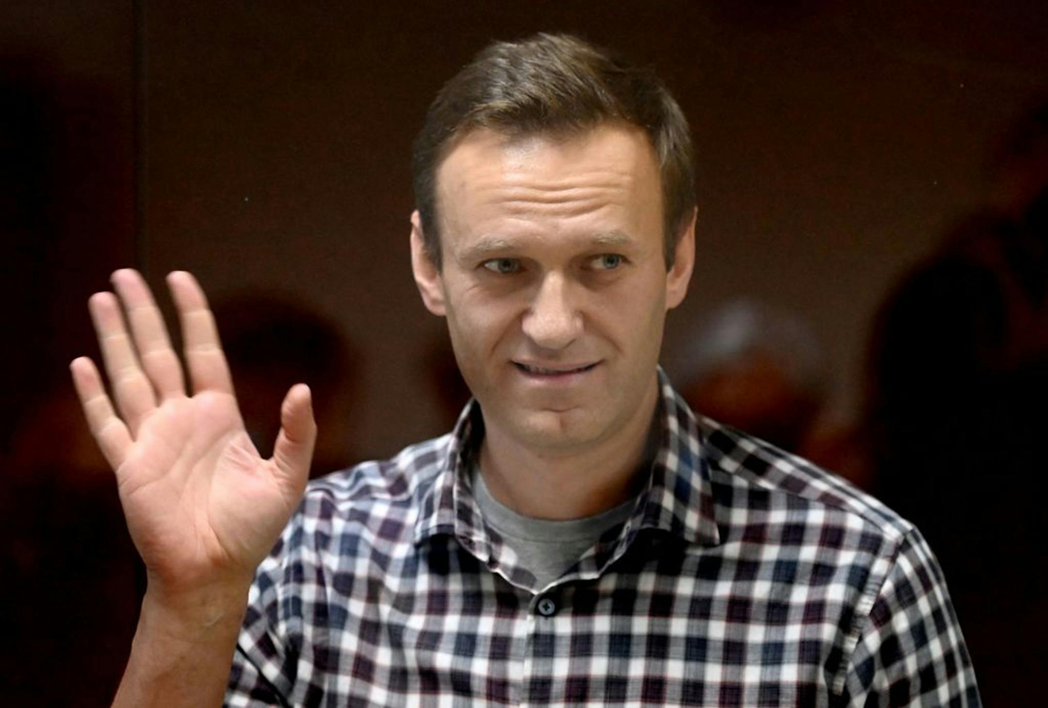 Russian opposition leader Alexei Navalny stands inside a glass cell during a court hearing at the Babushkinsky district court in Moscow on Feb. 20, 2021. Navalny's treatment by Russia has led in part to the latest round of U.S. sanctions against the country. (Photo by Kirill Kudryavtsev/AFP via Getty Images/TNS) ORG XMIT: 24813263W