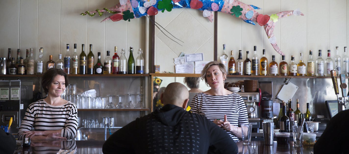 Servers/bartenders Raleigh Phillips, left, who has worked for Modern Cafe for over ten years, and Erikka Curran, who has worked there six years, tend bar at the Modern Cafe in Minneapolis on Tuesday, March 10, 2015. ] LEILA NAVIDI leila.navidi@startribune.com / BACKGROUND INFORMATION: The Modern Cafe, open since 1994, will close on March 14, 2015.