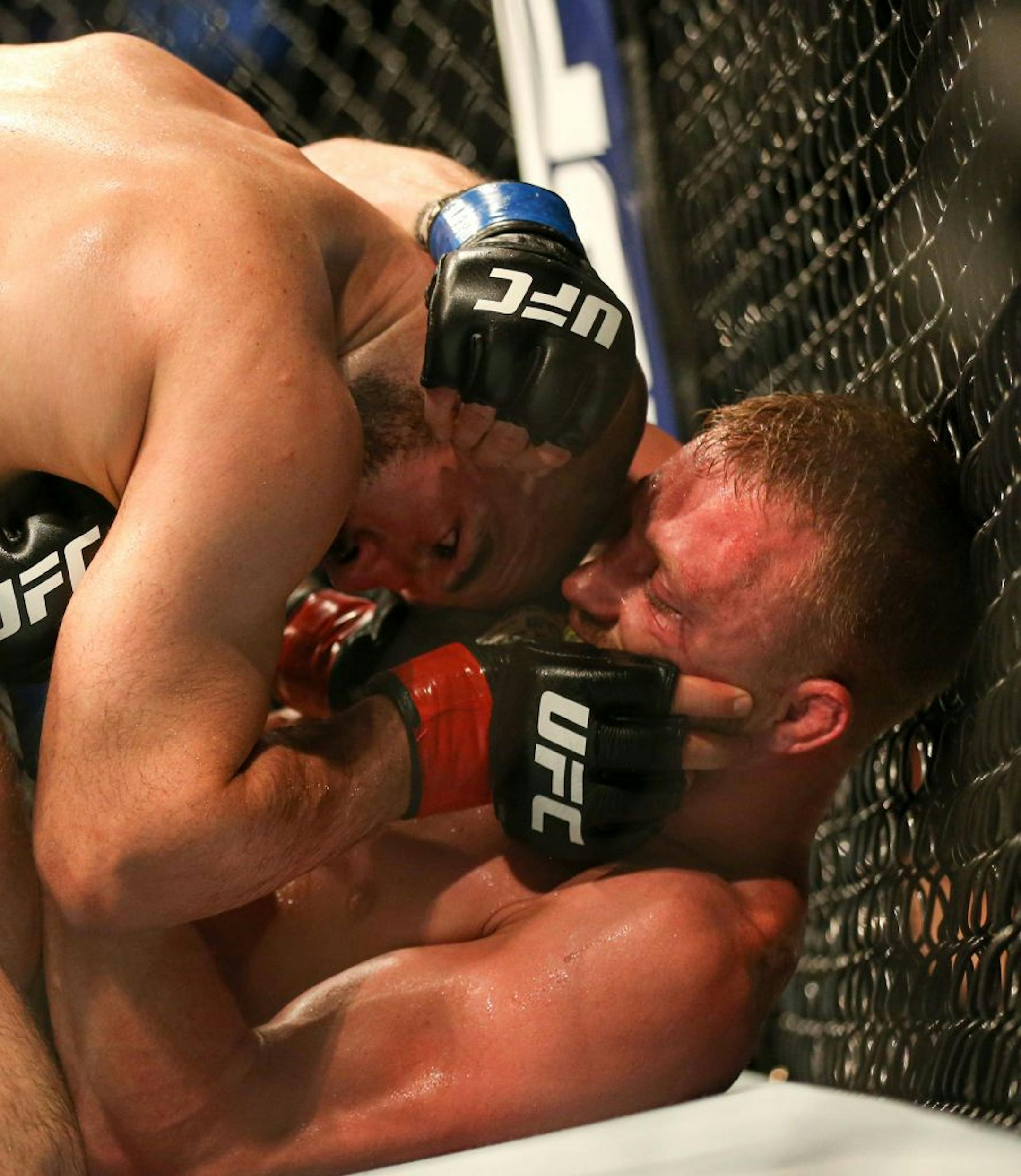 Dan Moret is subdued by Jared Gordon on the floor against the cage. Gordon would go on to win the match by unanimous decision. ALEX KORMANN ¥ alex.kormann@startribune.com UFC Fight Night was held at Target Center on Saturday June 29, 2019. Francis Ngannou and Junior Dos Santos headlined the event.