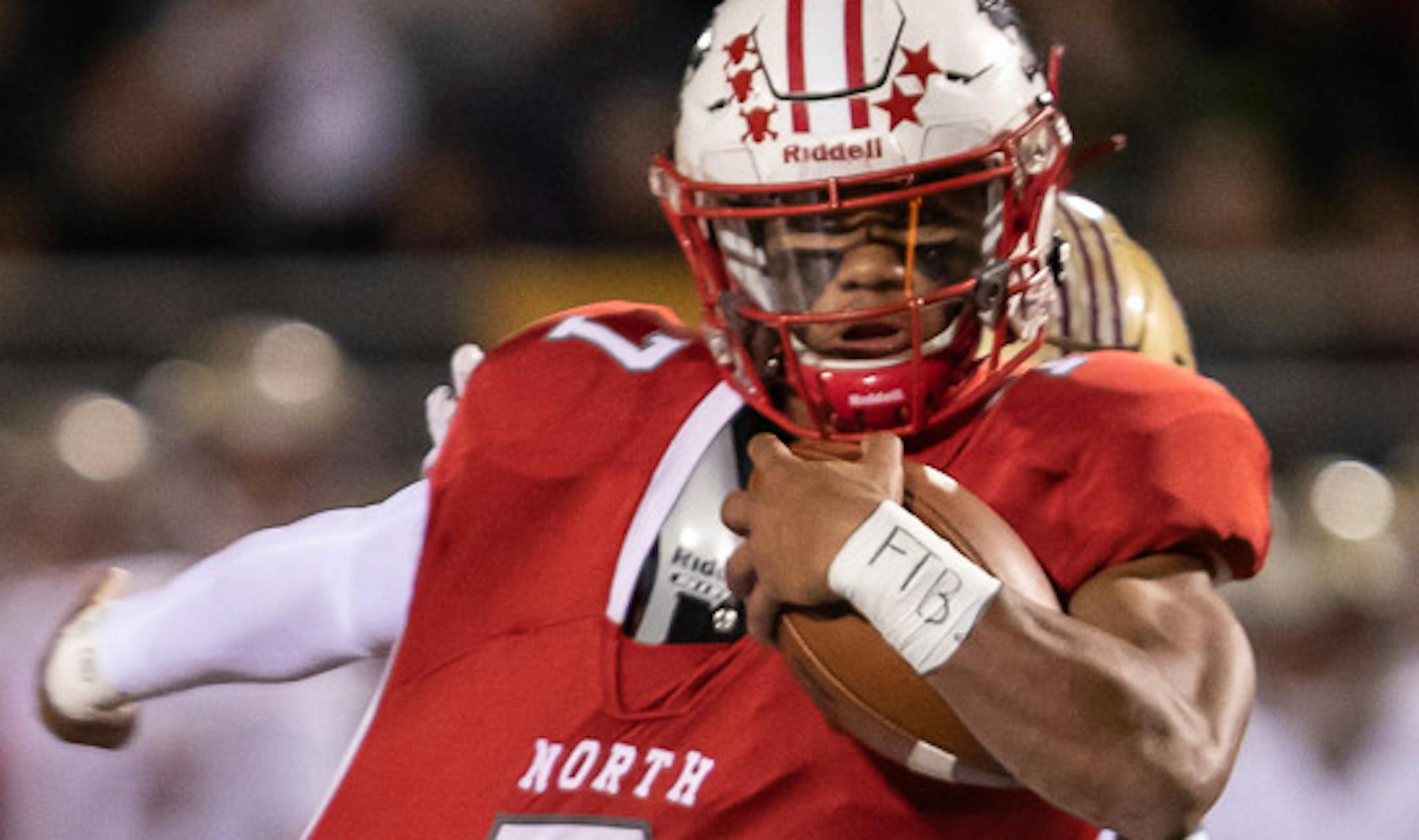 Lakeville North running back / defensive back RaJa Nelson (7) tries to break free from the grip of Lakeville South DB George Brekke (2). [ Special to Star Tribune, photo by Matt Blewett, Matte B Photography, matt@mattebphoto.com, October 3, 2019, Lakeville North High School, Lakeville, Minnesota, SAXO 1009672801 PREP.lake
