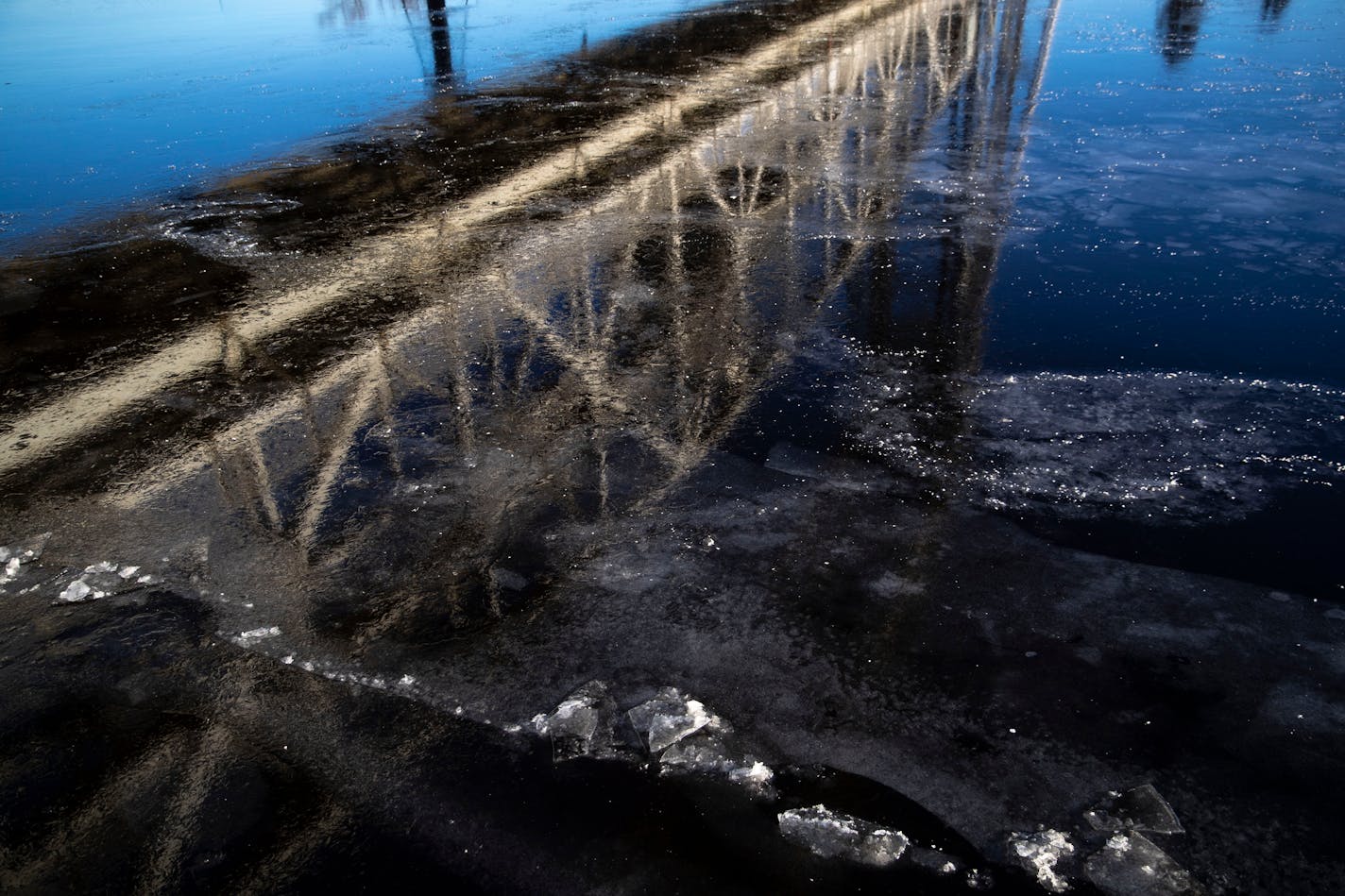 The Aerial Lift Bridge in Duluth was reflected on the Duluth Harbor on a small patch of ice that had formed. ]