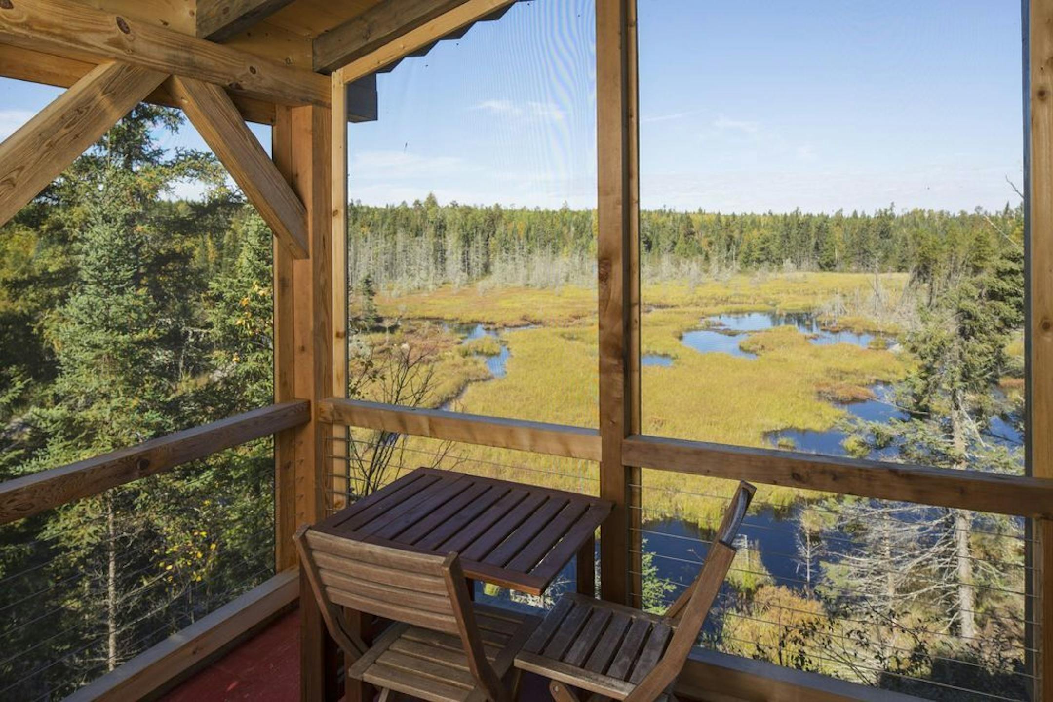 The porch view of the pond and acreage, which abuts the BWCA.