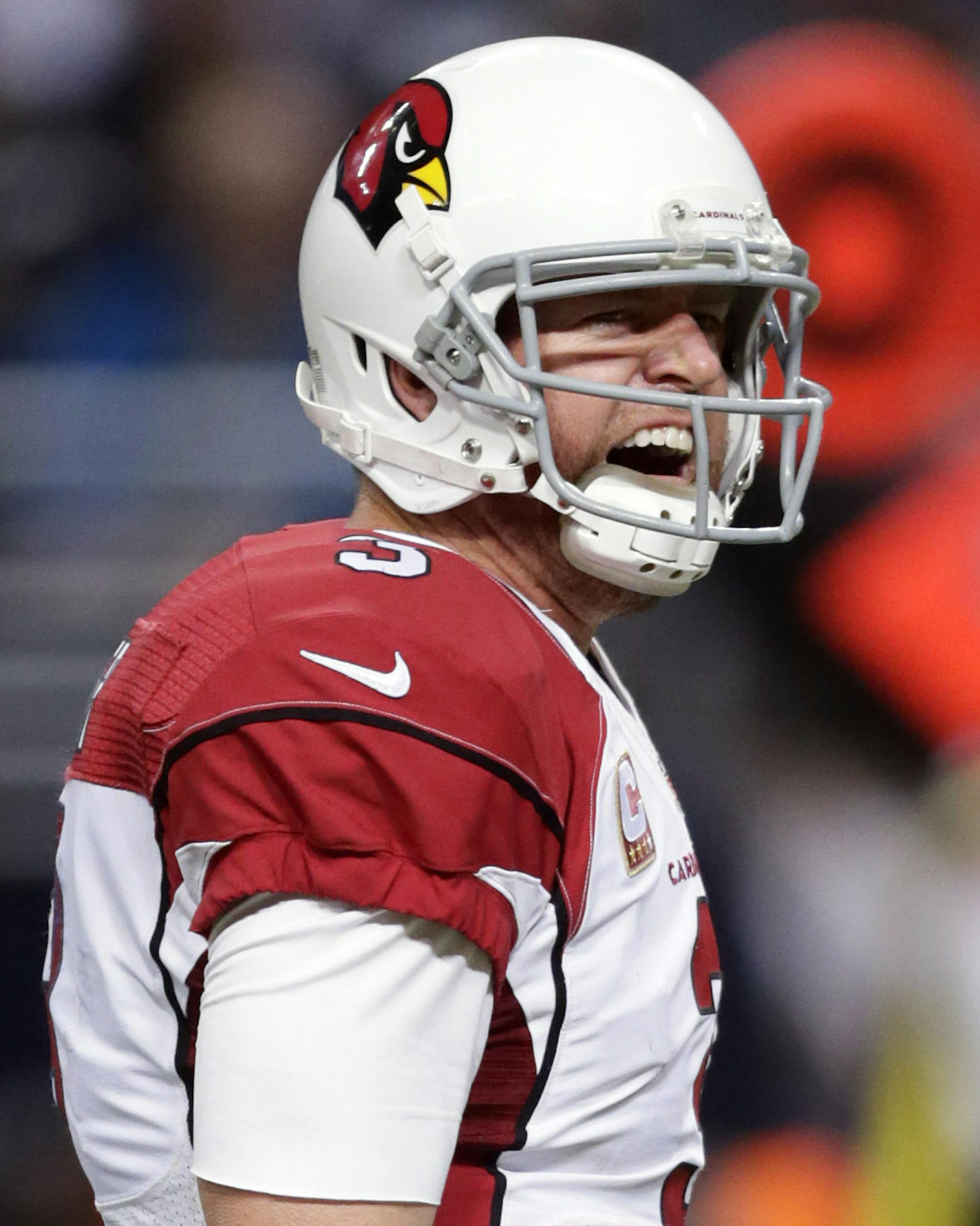 Arizona Cardinals quarterback Carson Palmer yells during the third quarter of an NFL football game against the St. Louis Rams on Sunday, Dec. 6, 2015, in St. Louis. (AP Photo/Tom Gannam) ORG XMIT: MOJR