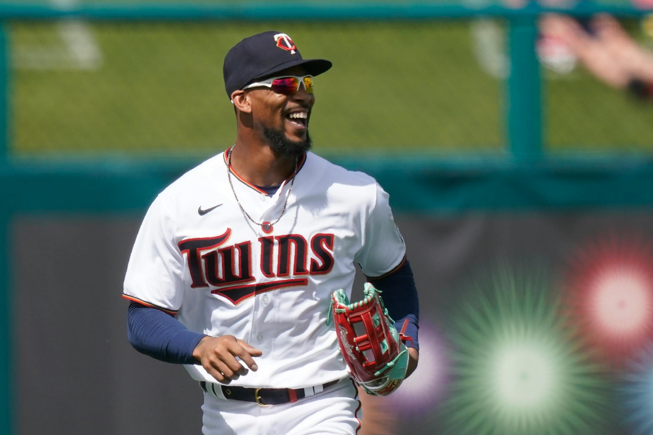 Minnesota Twins center fielder Byron Buxton runs off the field smiling after an outfield catch in the second inning during a spring training baseball game against the Boston Red Sox on Sunday, Feb. 28, 2021, in Fort Myers, Fla. (AP Photo/Brynn Anderson)