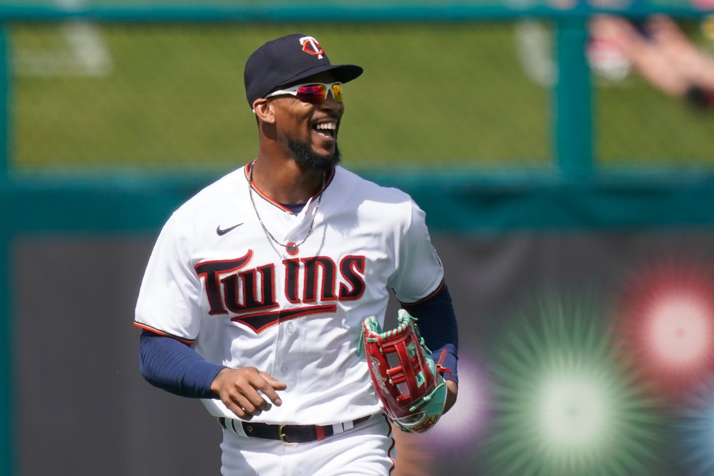 Minnesota Twins center fielder Byron Buxton runs off the field smiling after an outfield catch in the second inning during a spring training baseball game against the Boston Red Sox on Sunday, Feb. 28, 2021, in Fort Myers, Fla. (AP Photo/Brynn Anderson)