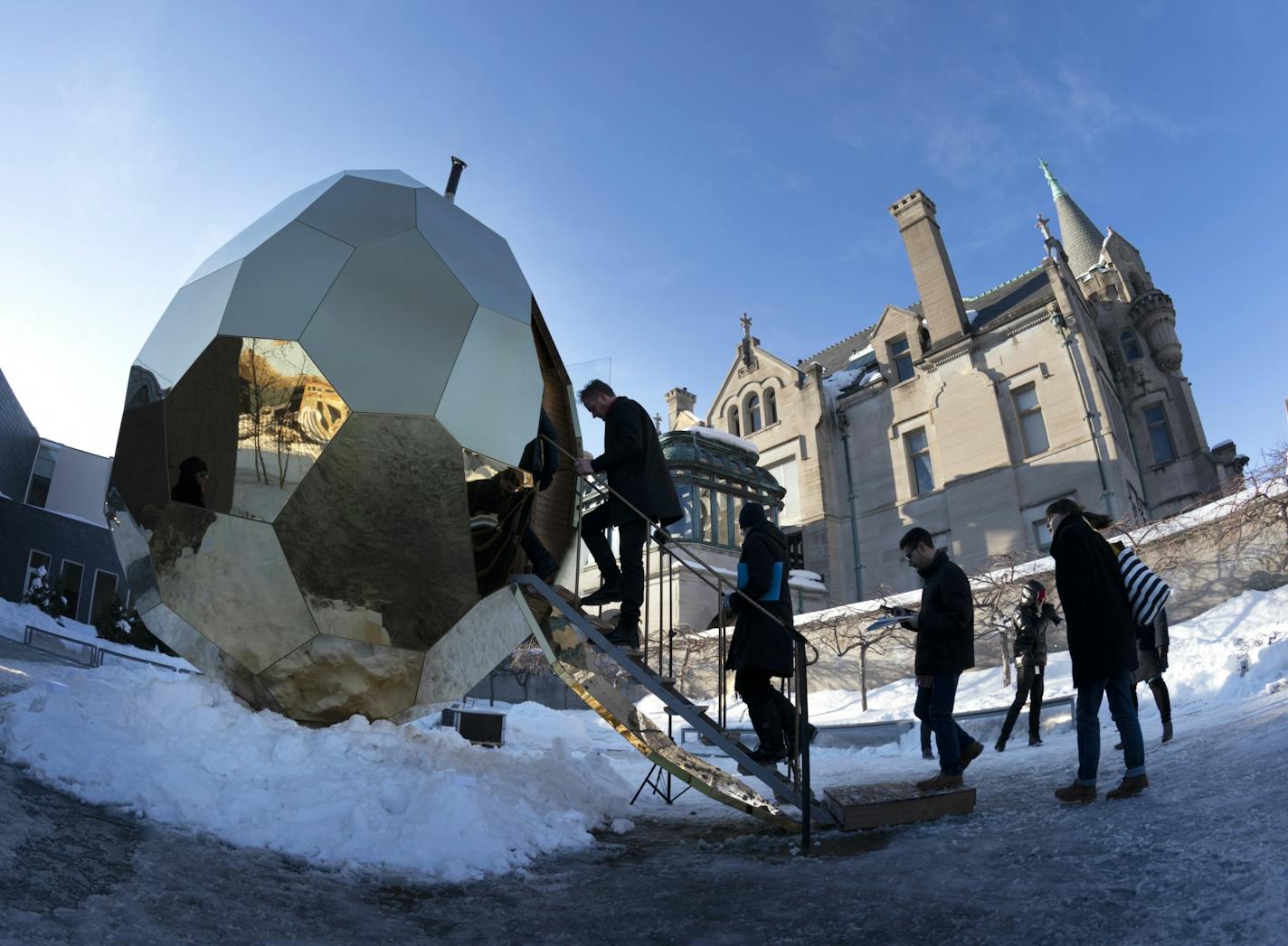 A golden, mirrored, 15-foot-tall egg is on display at the American Swedish Institute. It's a sculpture -- but it's also a functioning sauna. Swedish artists Mats Bigert and Lars Bergstrom (at top of steps) have brought their artwork to the US for the first time.