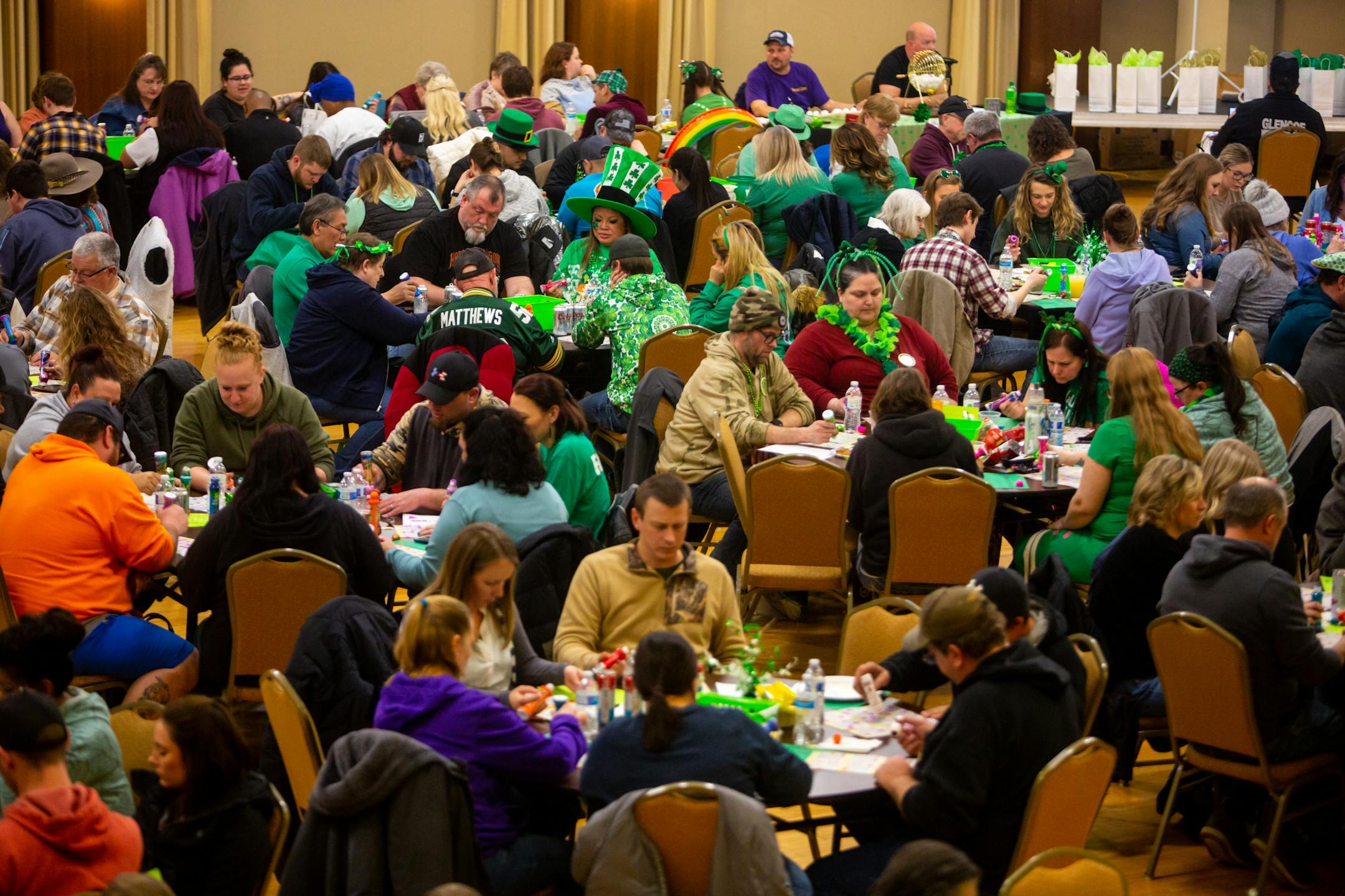 Hundreds gather for a chance to win a designer purse or a gun during Designer Purse &amp; Gun Bingo, a fundraiser for Glencoe Days.