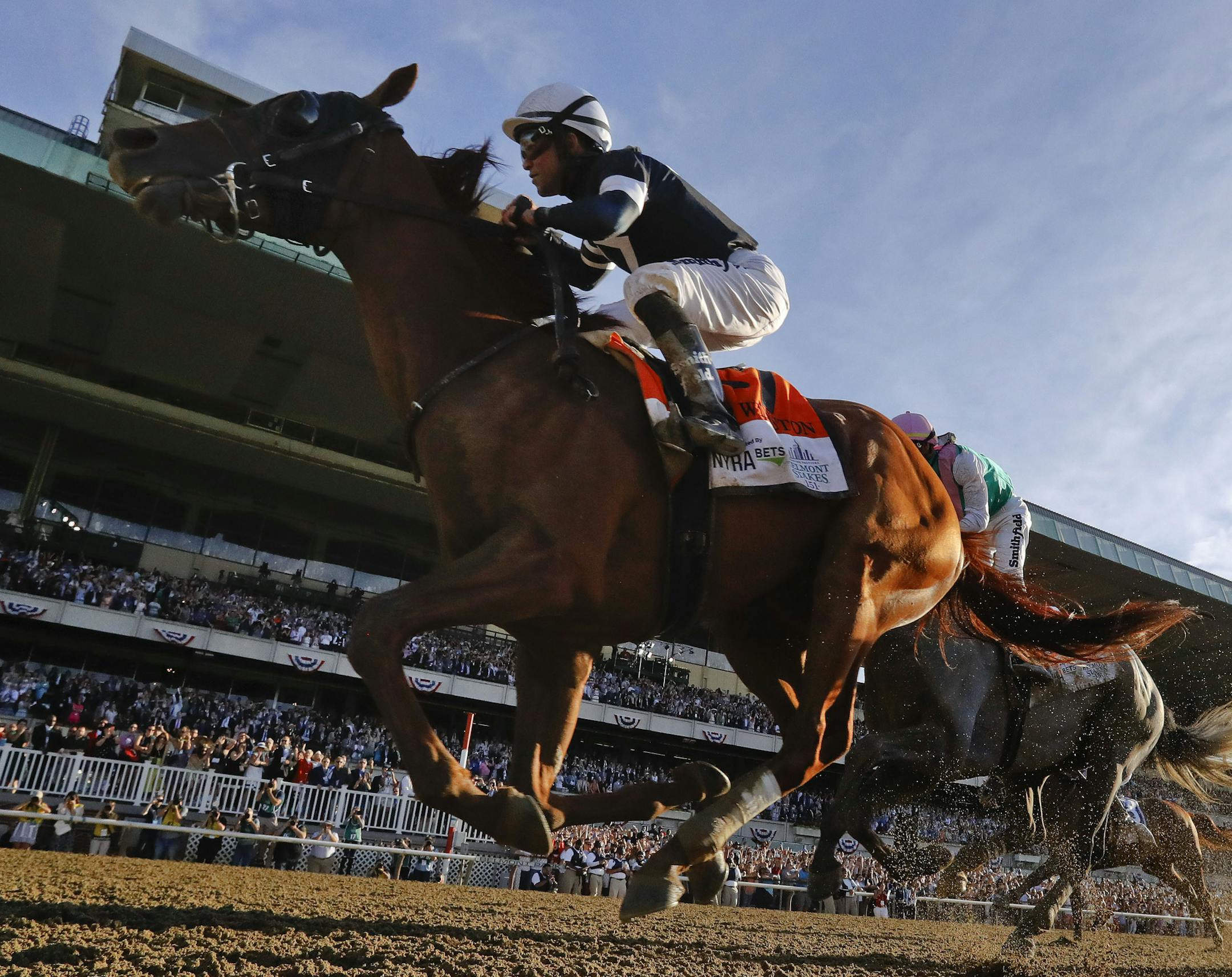 Sir Winston (7), with jockey Joel Rosario up, crosses the finish line to win the 151st running of the Belmont Stakes horse race, Saturday, June 8, 2019, in Elmont, N.Y. (AP Photo/Seth Wenig)
