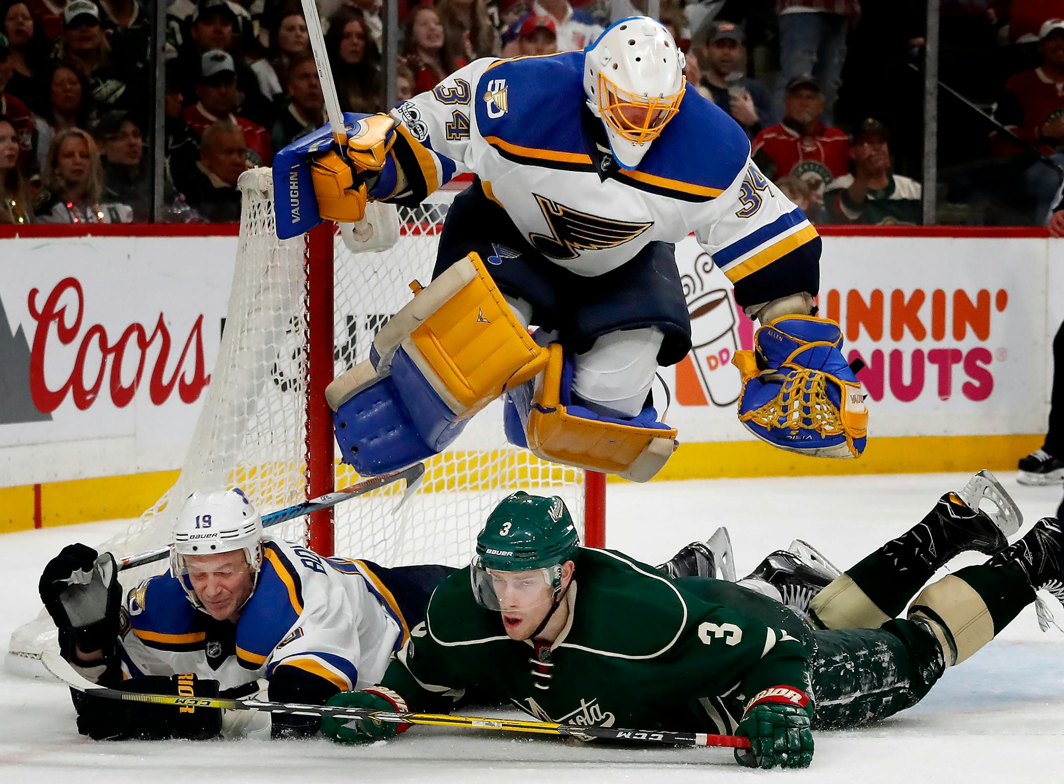 Blues goalie Jake Allen (34) jumped over Jay Bouwmeester (19) and Charlie Coyle (3) in Game 2 of last year's playoffs.