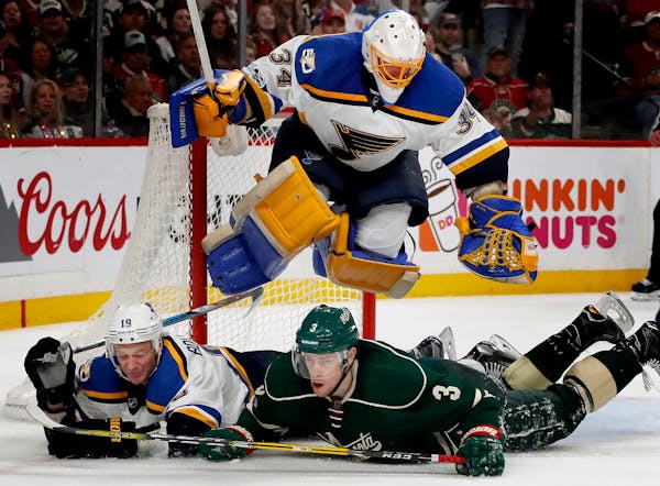 Blues goalie Jake Allen (34) jumped over Jay Bouwmeester (19) and Charlie Coyle (3) in Game 2 of last year's playoffs.