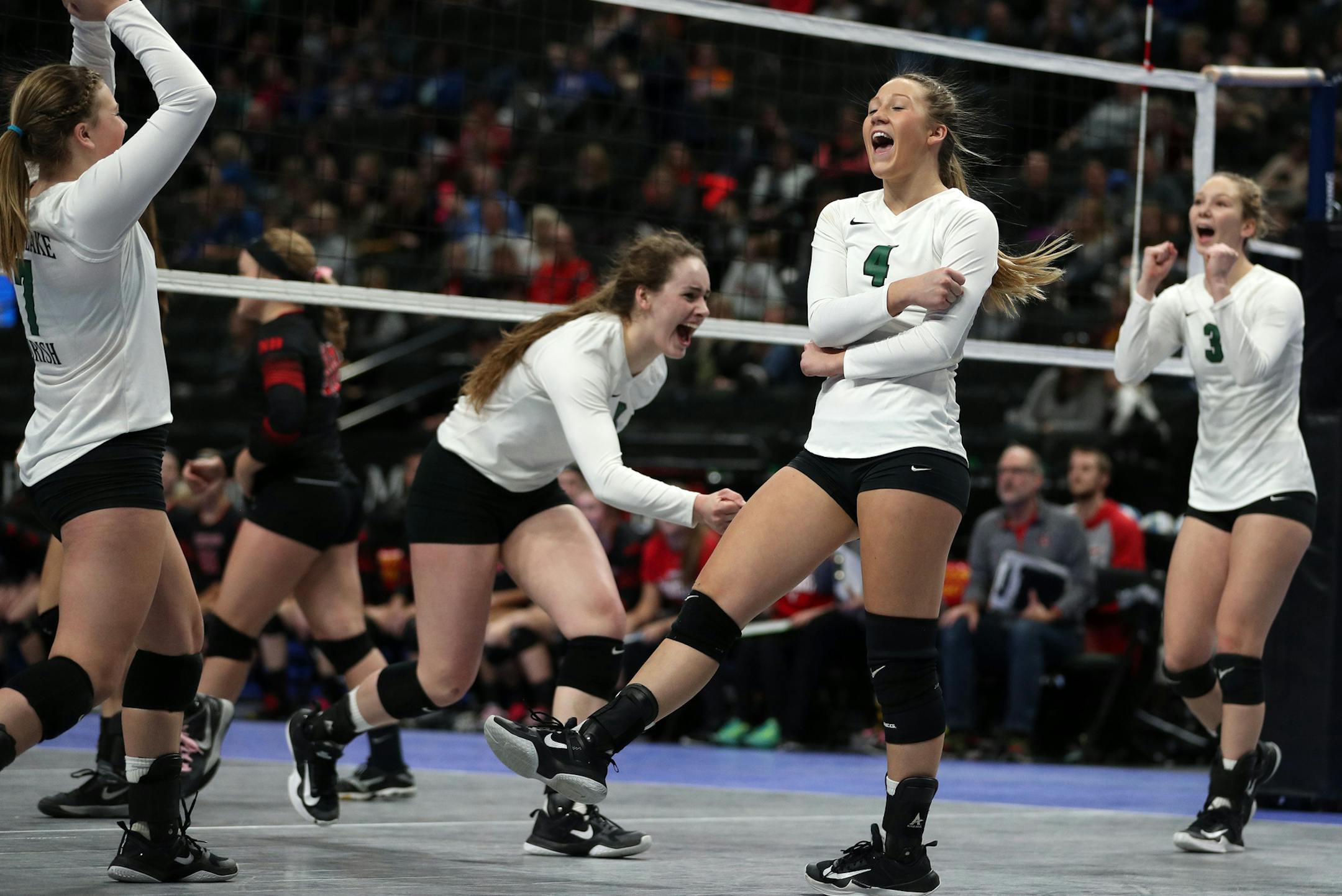 Maple Lake High School's Linsey Rachel (4) and her teammates celebrated a point in the third set. ] ANTHONY SOUFFLE ï anthony.souffle@startribune.com Game action from a Class 2A championship volleyball game between Maple Lake High School and North Branch High School Saturday, Nov. 11, 2017 at the Xcel Energy Center in St. Paul, Minn.