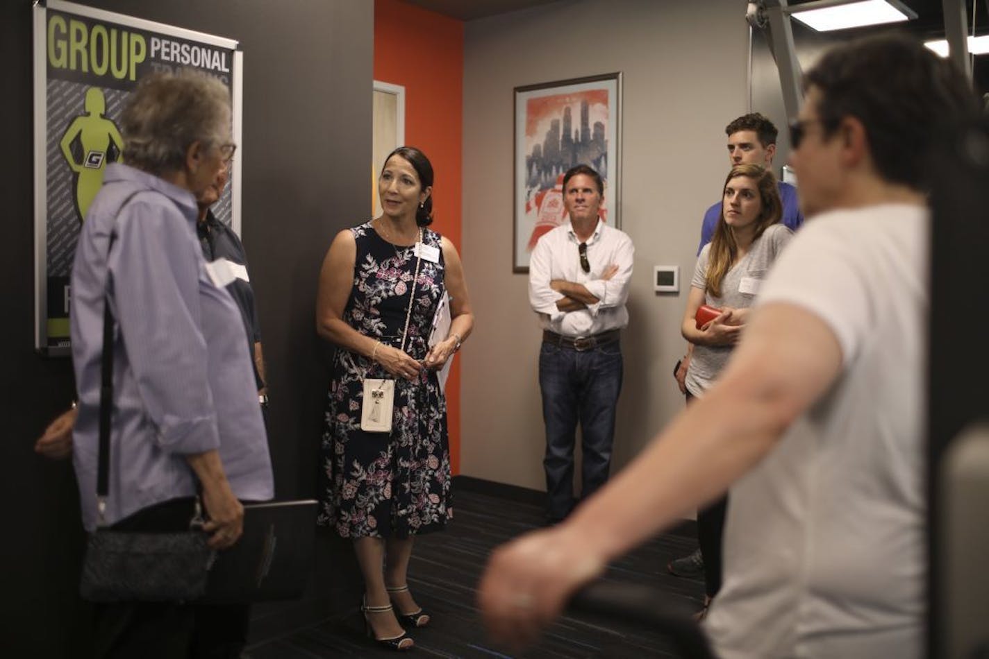 Hope Summers led a group on a tour of Abiitan Mill City, beginning here in the fitness center.