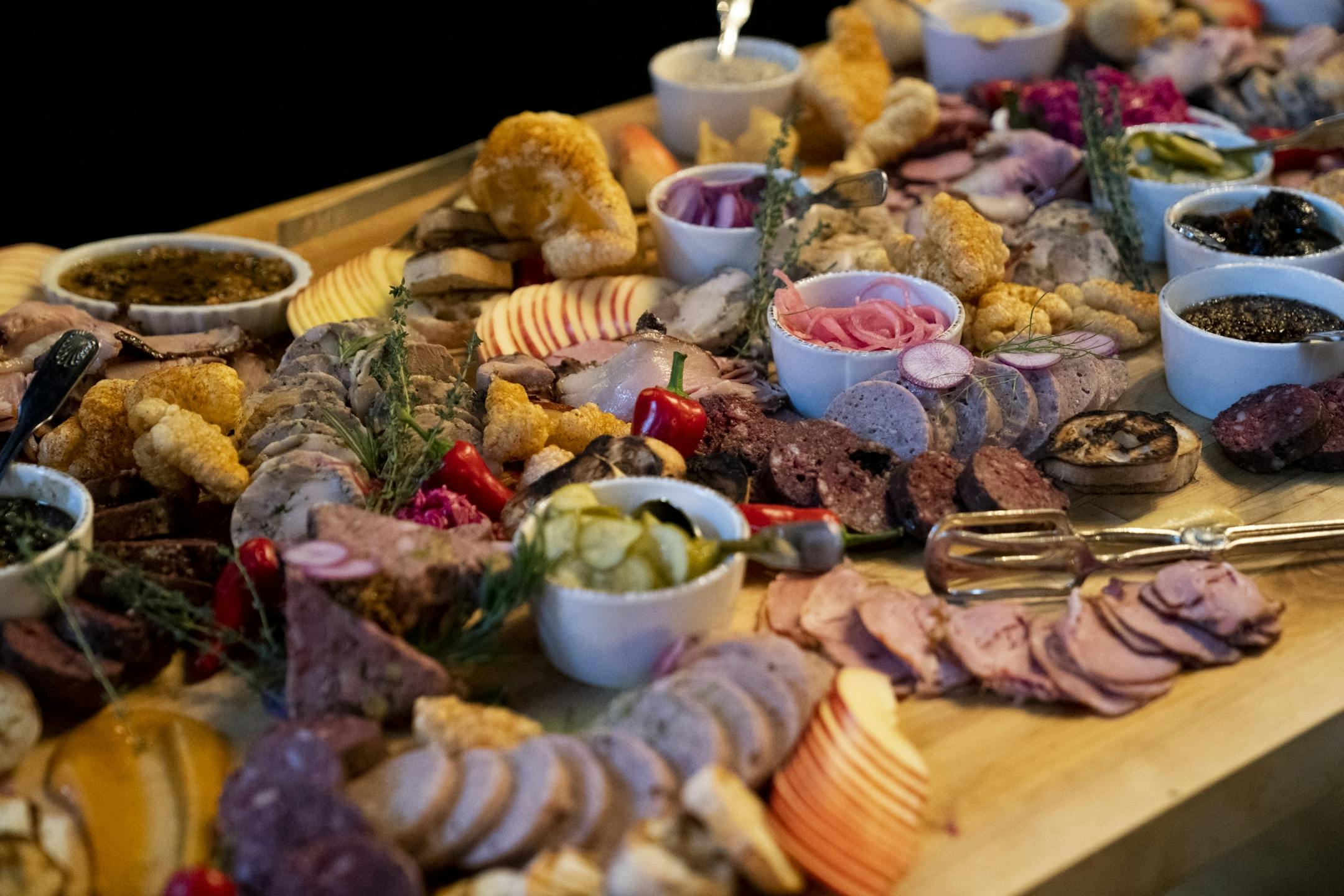 A smorgasbord at the Handsome Hog in St. Paul, Minn., that was part of a six course meal hosted by chef Justin Sutherland before a viewing party of Top Chef, a show Sutheland is a contestant on, on Thursday, January 17, 2019.