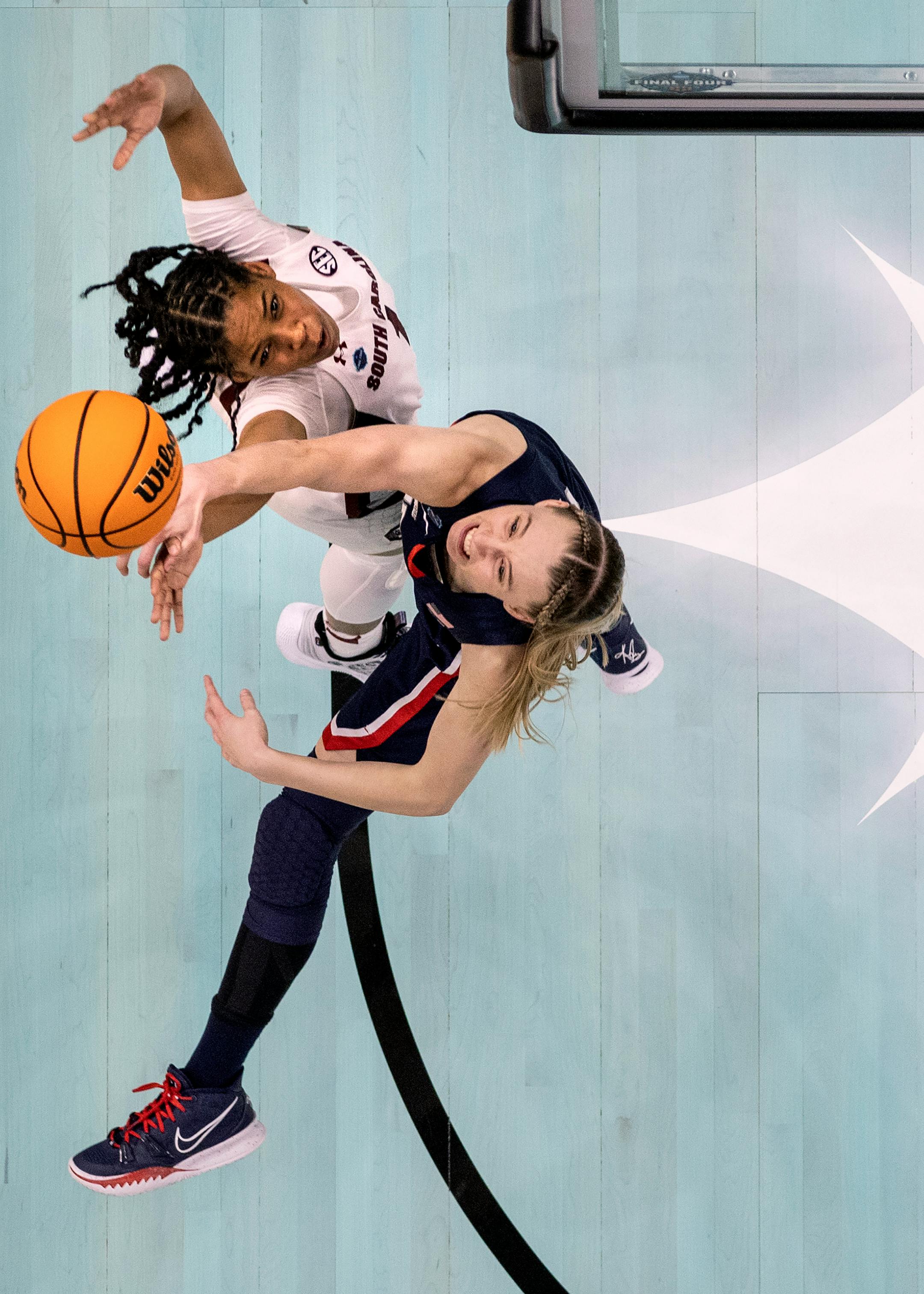 Paige Bueckers (5) of University of Connecticut blocks a shot by Zia Cooke (1) of South Carolina.